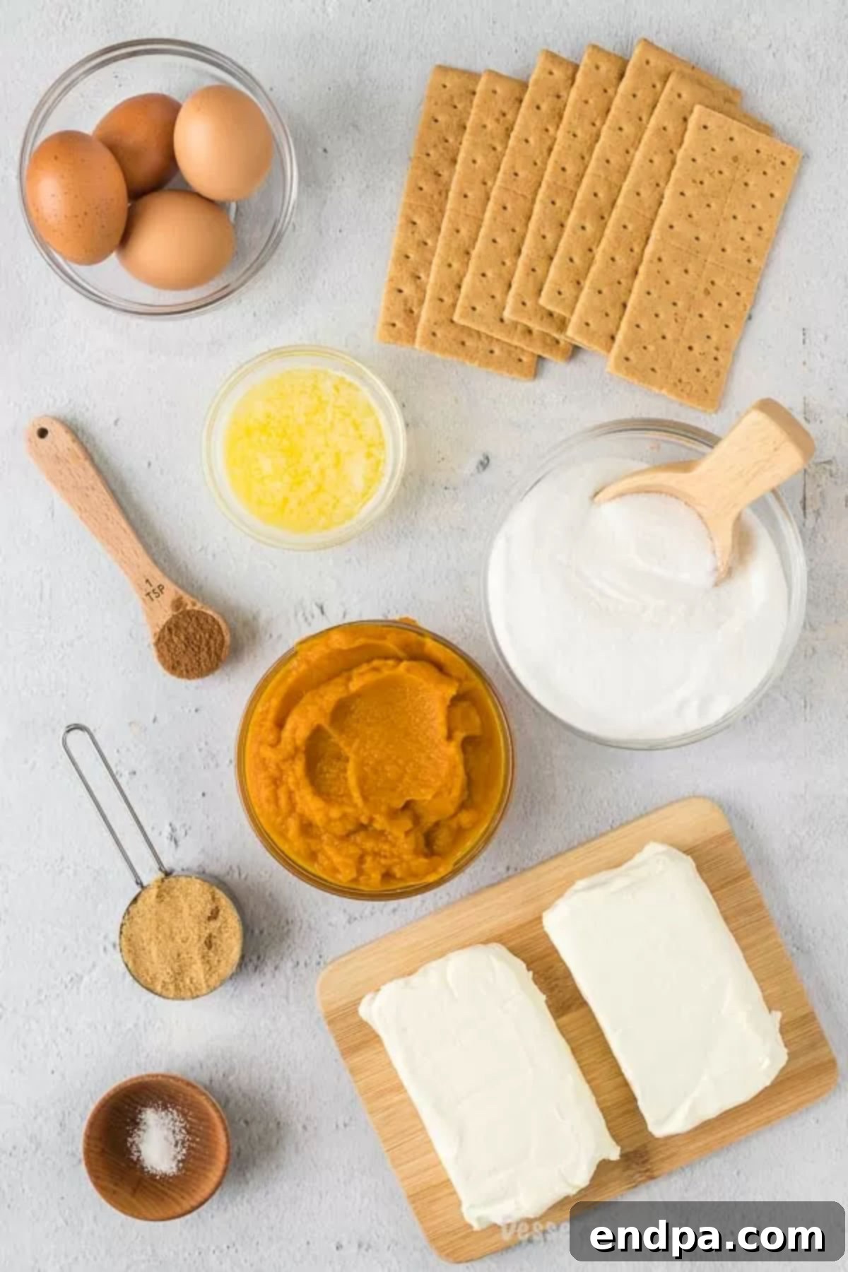 Spiced Pumpkin Cheesecake Bars 3 Ingredients to make pumpkin cheesecake bars: Graham Crackers, Brown Sugar, Butter, Salt, Cream Cheese, sugar, Eggs, Canned Pumpkin, Pumpkin Pie Spice and whipped cream.