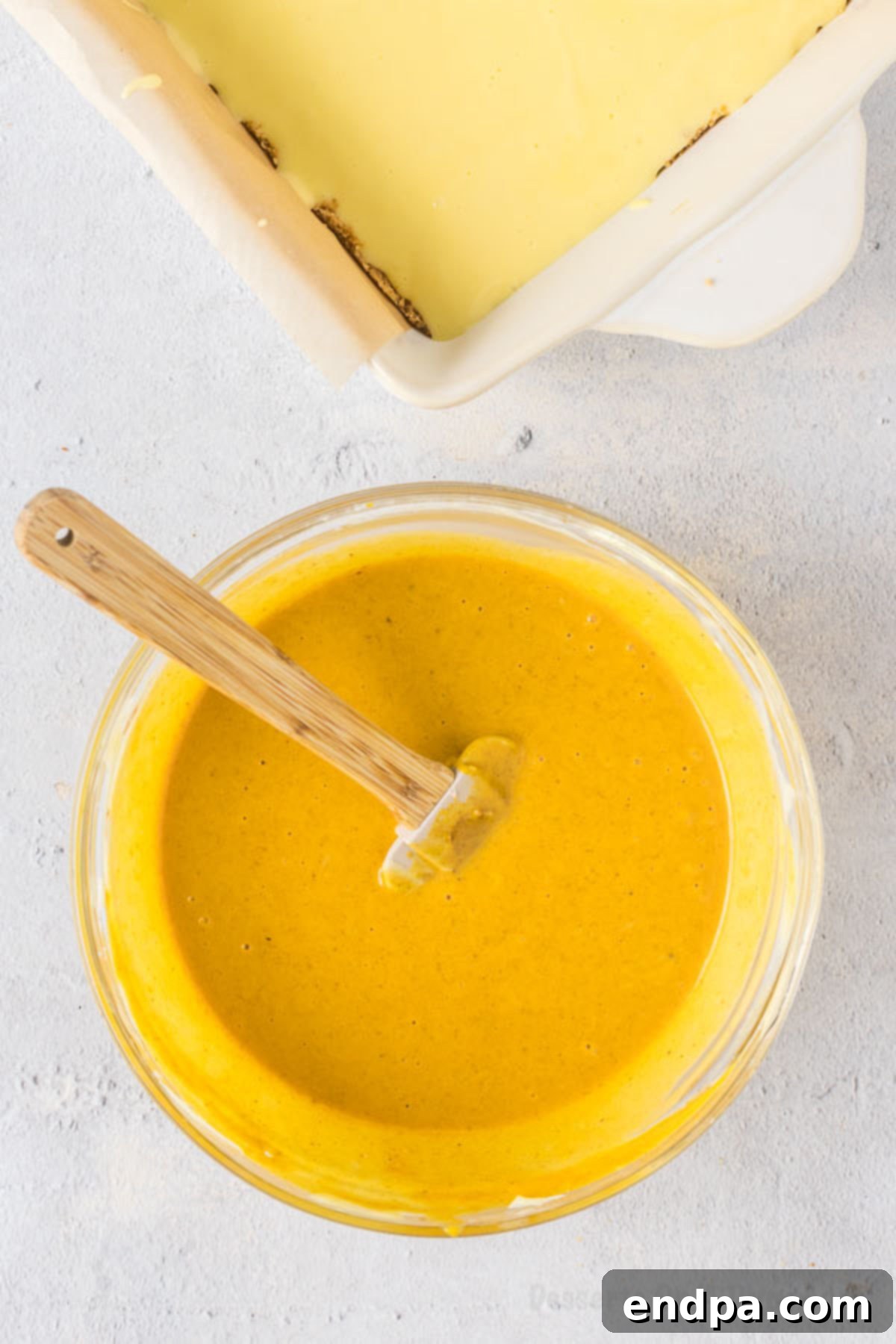 Spiced Pumpkin Cheesecake Bars 9 The canned pumpkin and pumpkin pie spice mixed into the remaining cream cheese mixture.