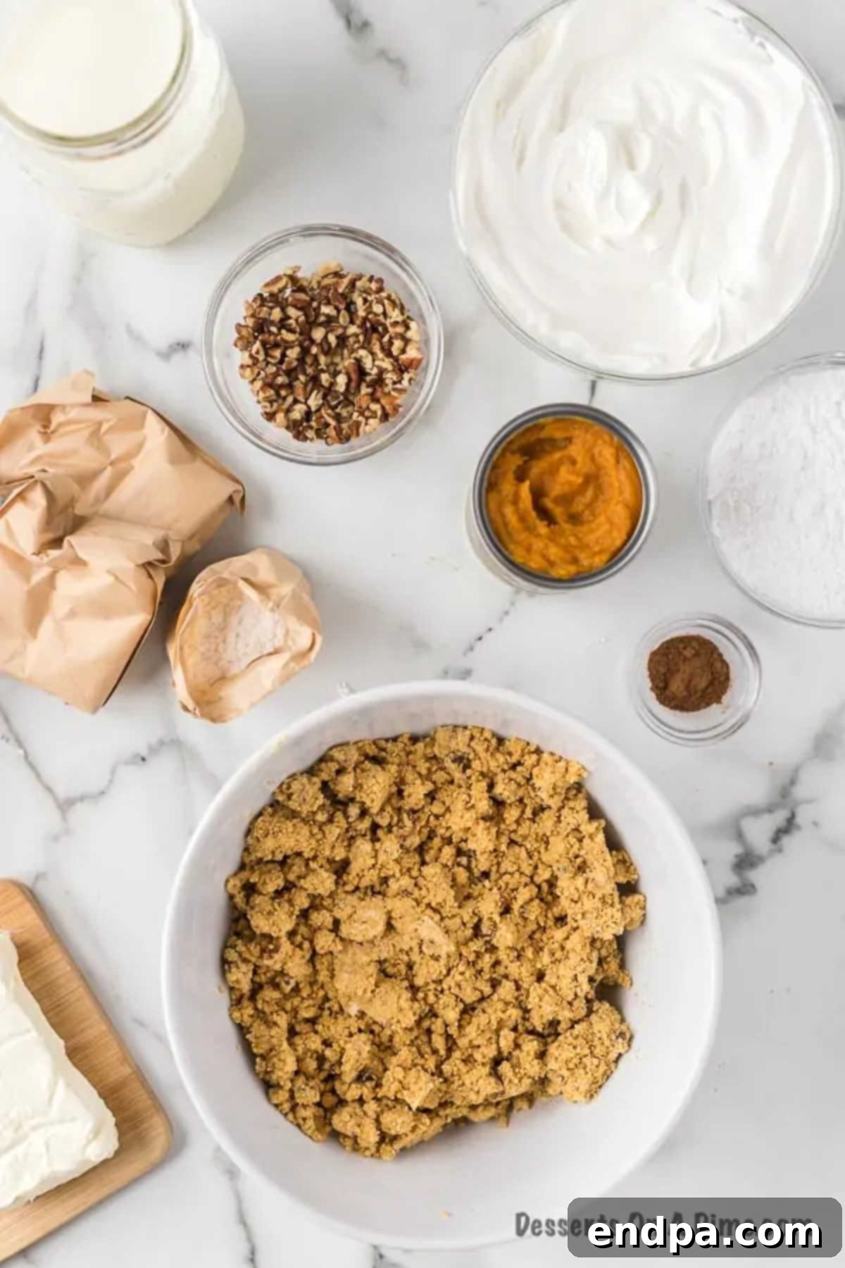 Mixing flour, graham cracker crumbs, melted butter, and chopped pecans in a bowl for the crust.