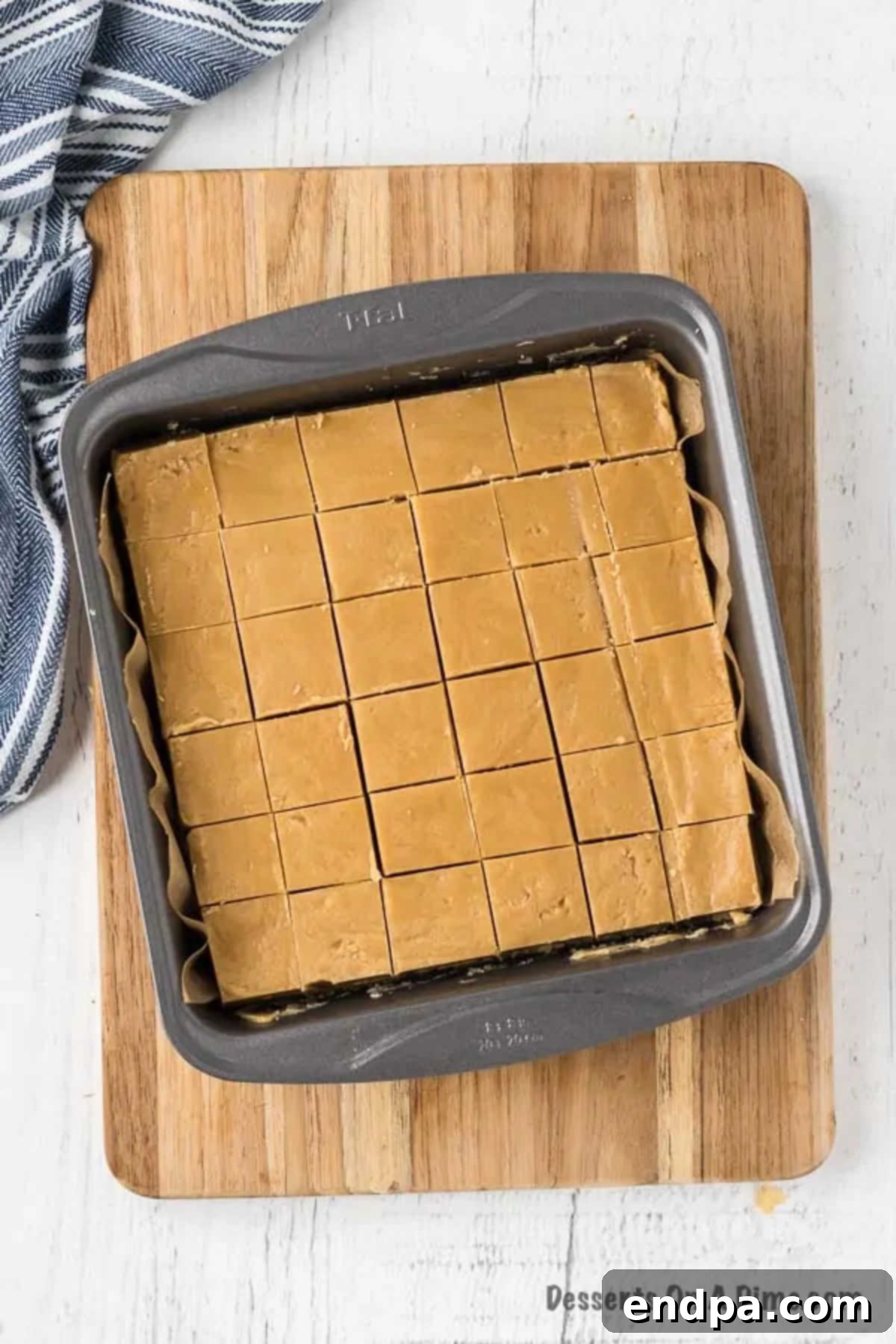 The set peanut butter fudge already scored into squares in the pan.