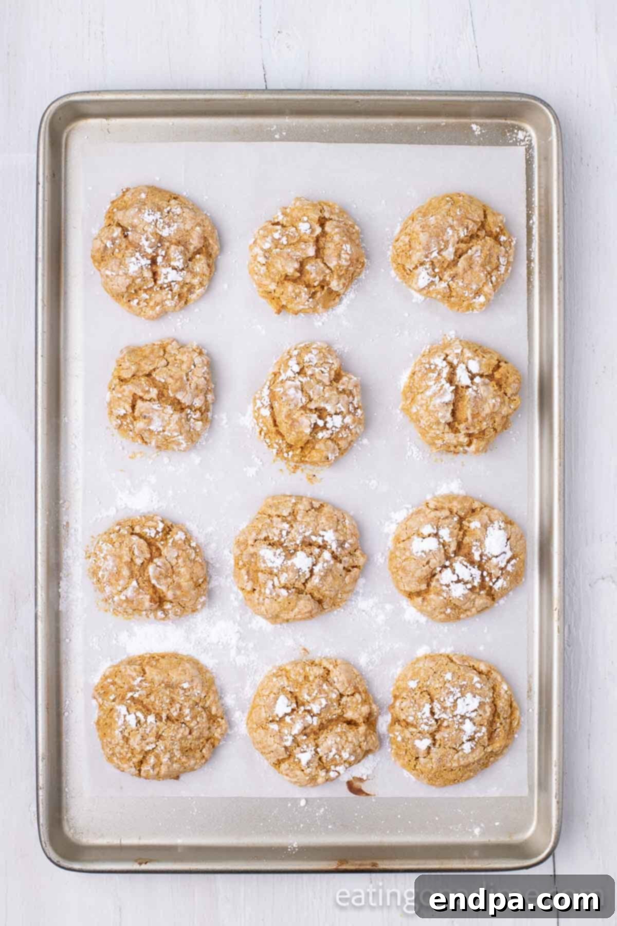 Cookies baked and cooling on baking sheet. 