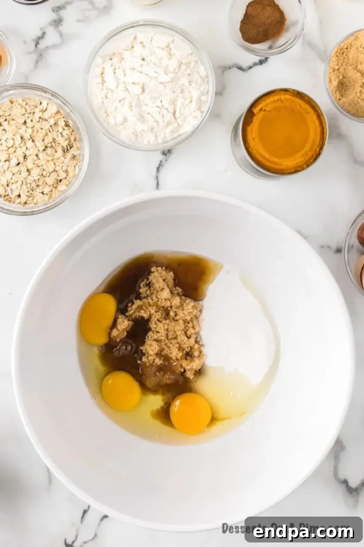 Autumn Pumpkin Crumble 4 Whisking eggs and brown sugar together in a mixing bowl until light and fluffy.