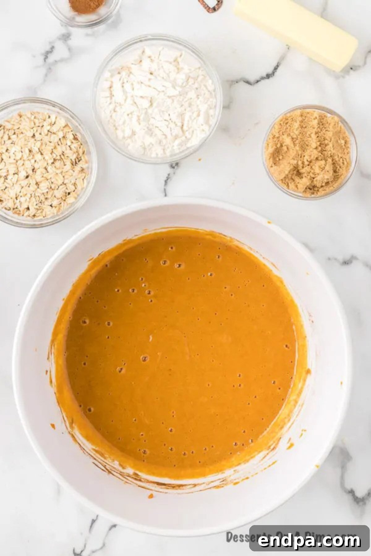 Autumn Pumpkin Crumble 5 Smooth pumpkin mixture blended with milk, spices, and vanilla extract in a bowl.