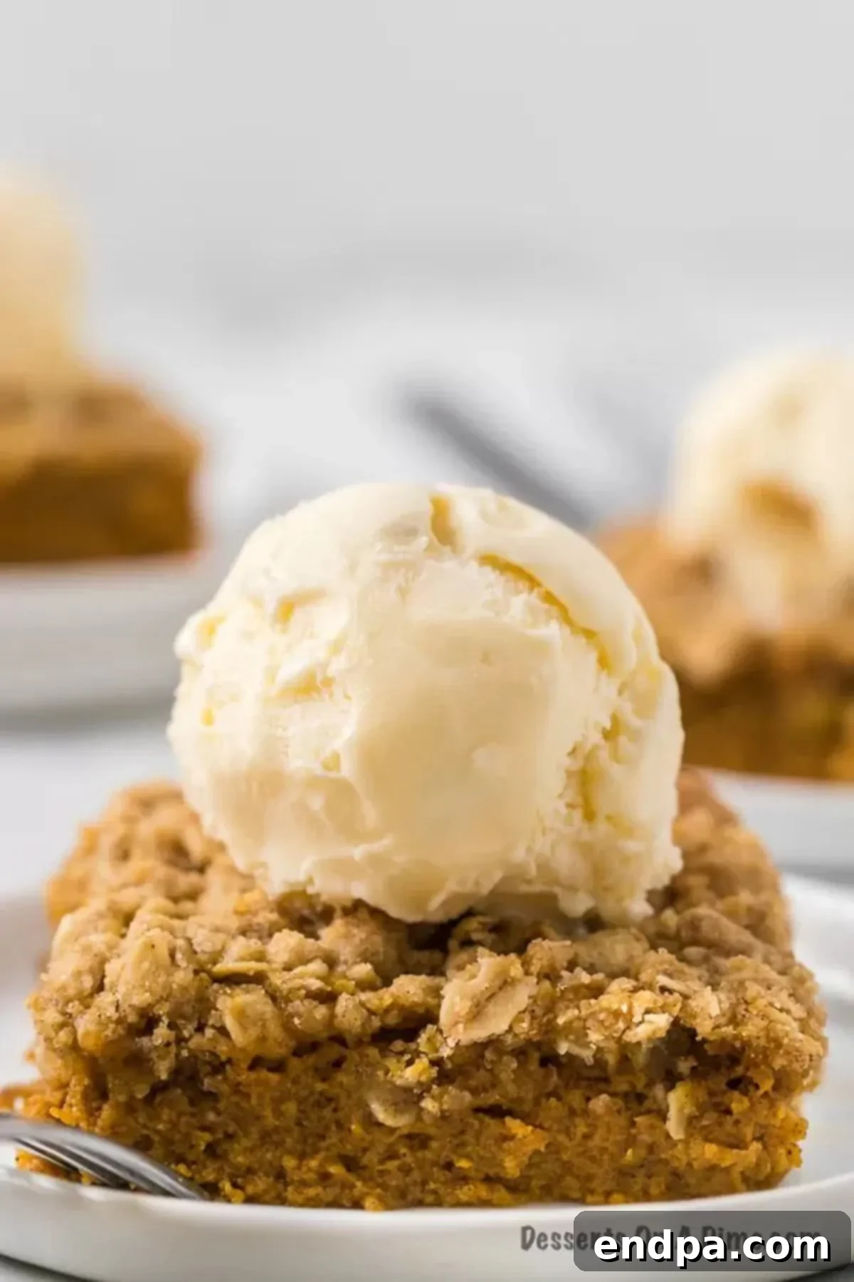 Autumn Pumpkin Crumble 9 Individual serving of Pumpkin Crisp topped with a melting scoop of vanilla ice cream.