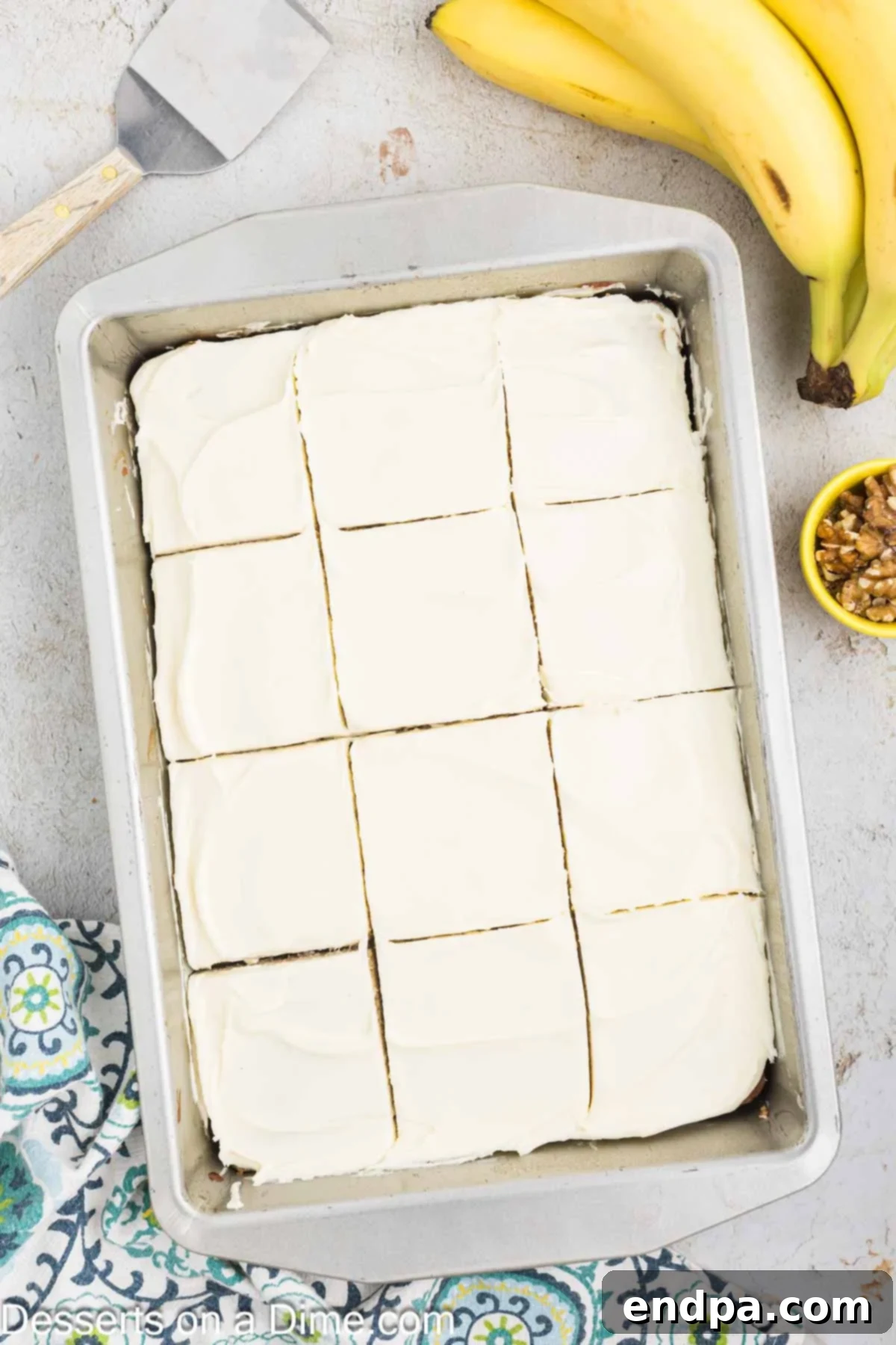 Ultimate Banana Bars 11 Frosted banana bars cut into neat square slices, ready for serving.