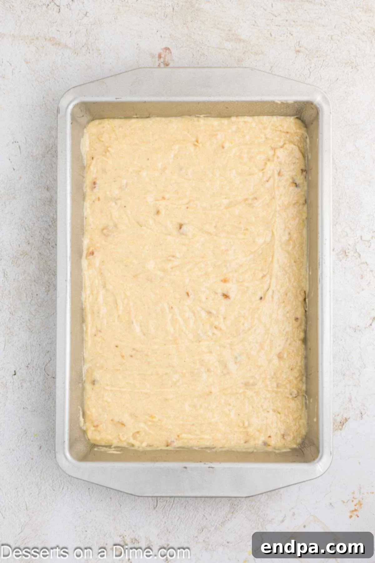 Ultimate Banana Bars 6 Banana bar batter evenly spread into a prepared 9x13 inch baking pan.
