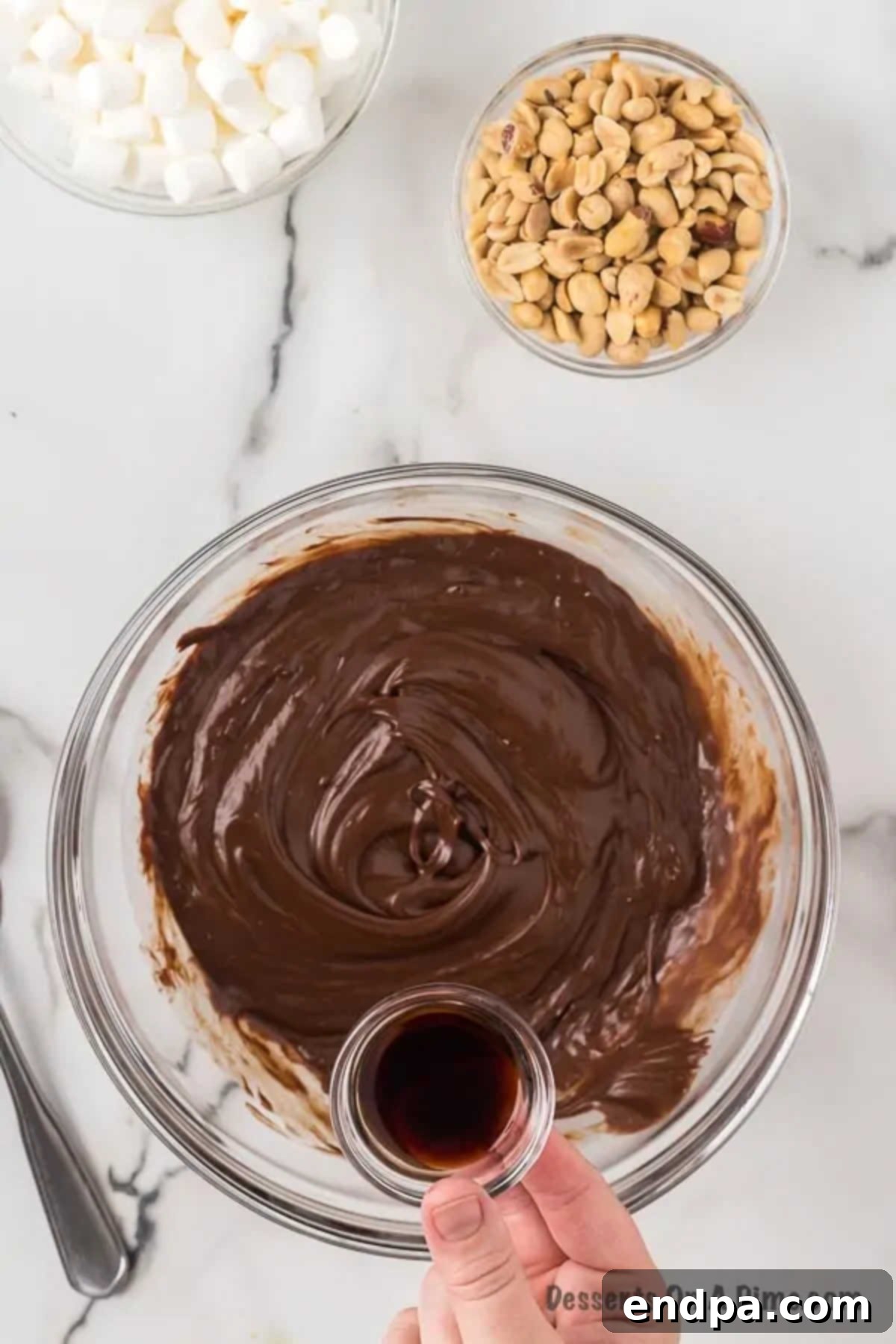 Chocolate mixture combined in a bowl. A perfectly smooth, glossy chocolate mixture in a glass bowl after melting, ready for the next ingredients.