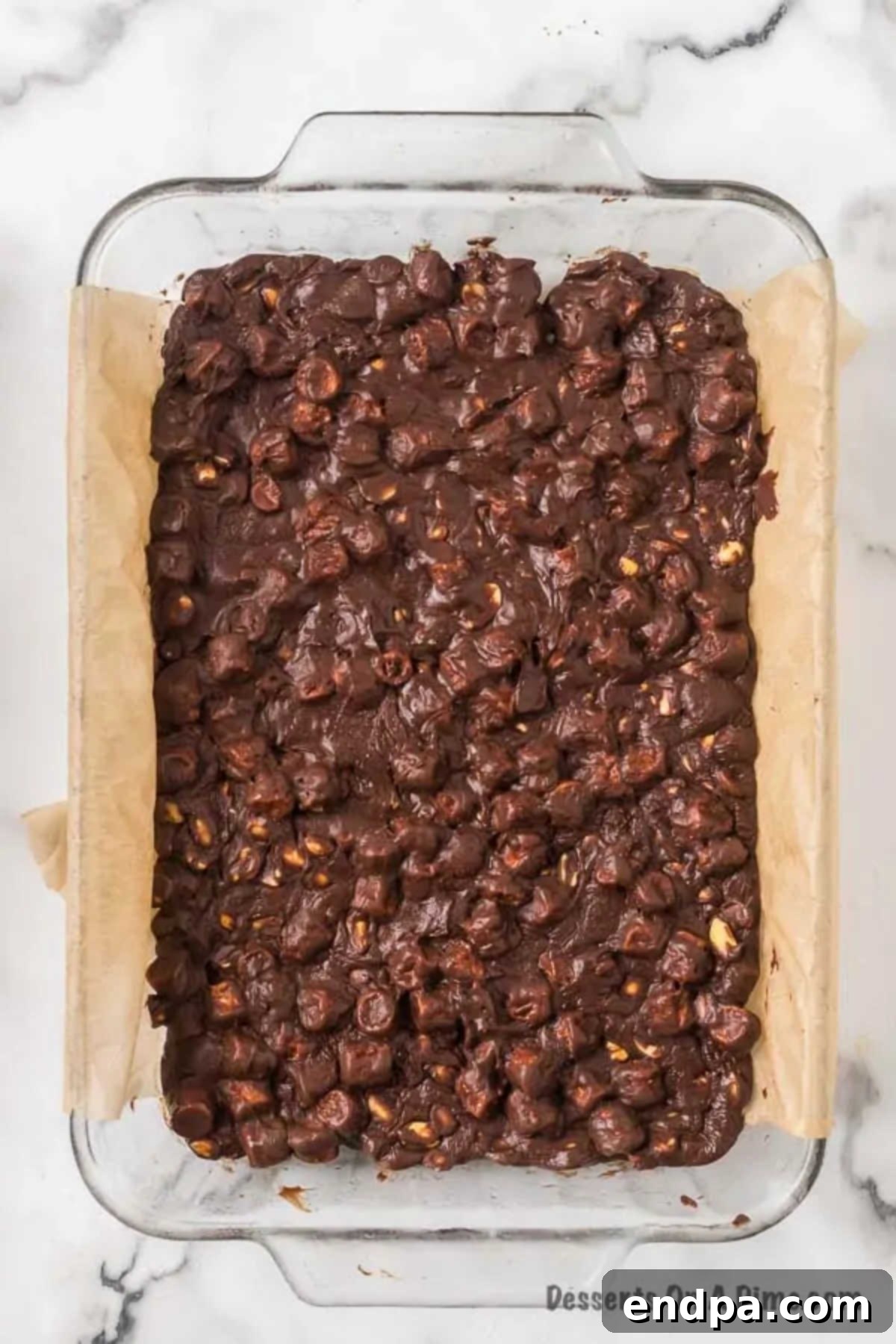 Mixture in pan ready to enjoy. The set Rocky Road fudge in the pan, ready to be lifted out and sliced.