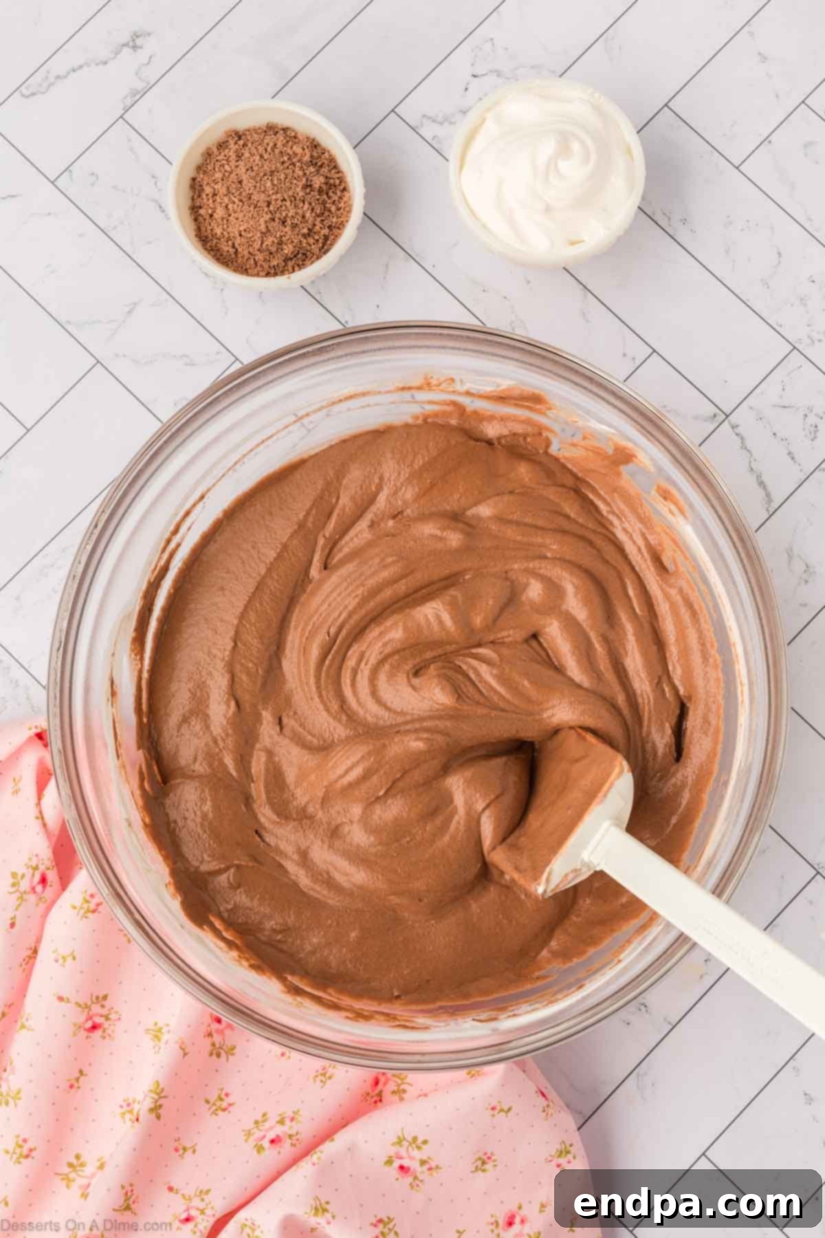 Whipped cream folded into chocolate mixture until combined.