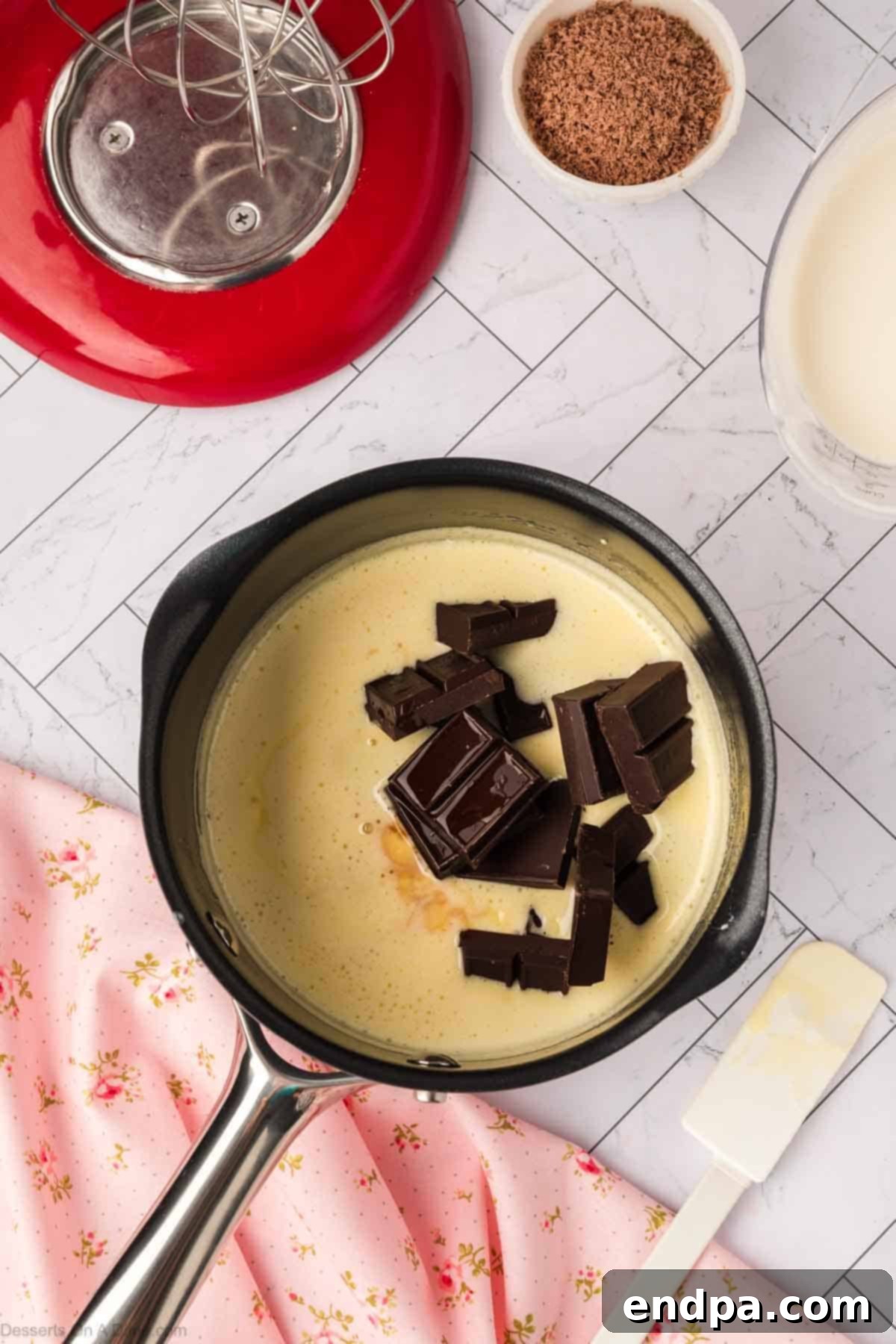 Chocolate and vanilla extract added to the warm mixture.