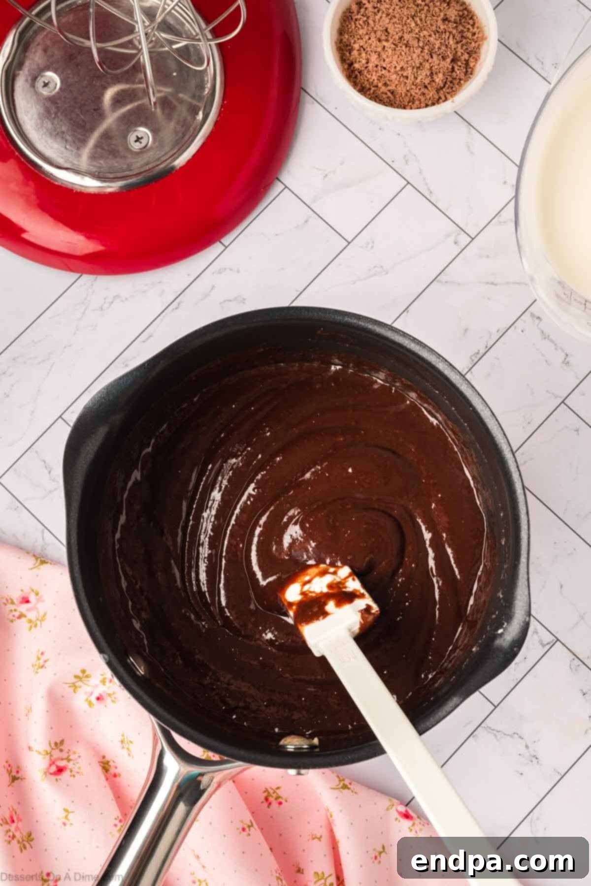 Melted chocolate mixture combined in the saucepan.