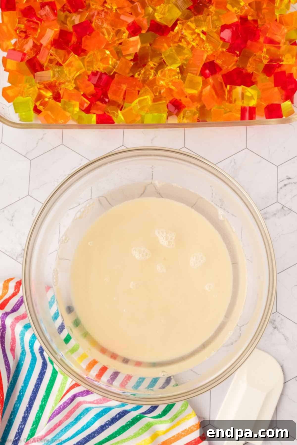 Vibrant Mosaic Gelatin 8 Sweetened condensed milk mixture combined in mixing bowl.