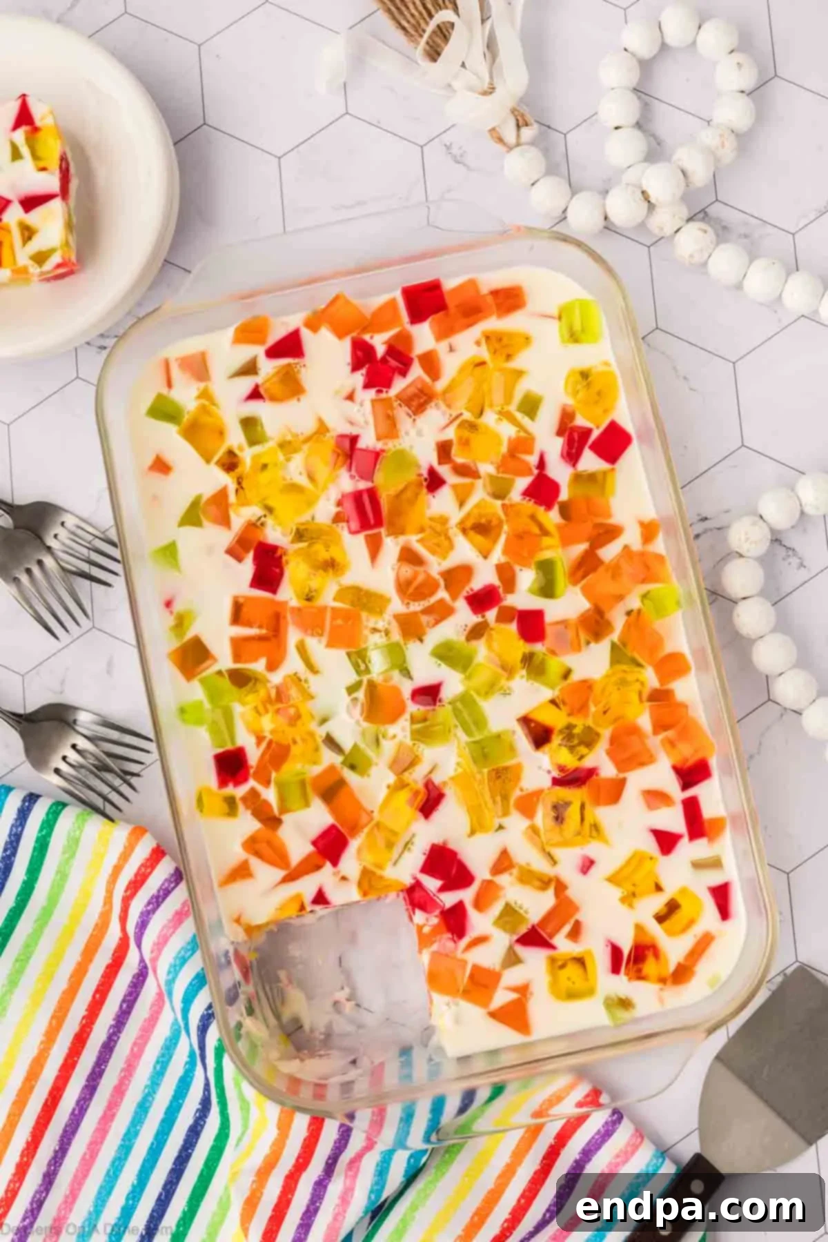 Vibrant Mosaic Gelatin 10 Slices being cut in baking dish.