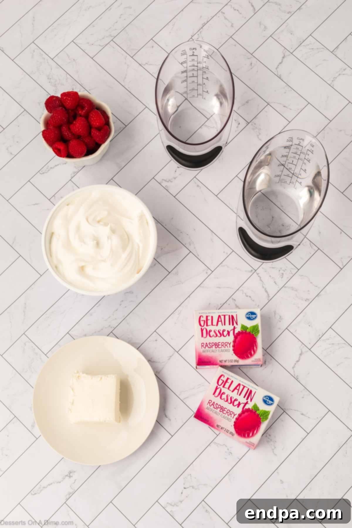 Layered Gelatin Delight 3 Individual ingredients for Jello parfait including Jello boxes, cream cheese, whipped topping, and fresh raspberries.