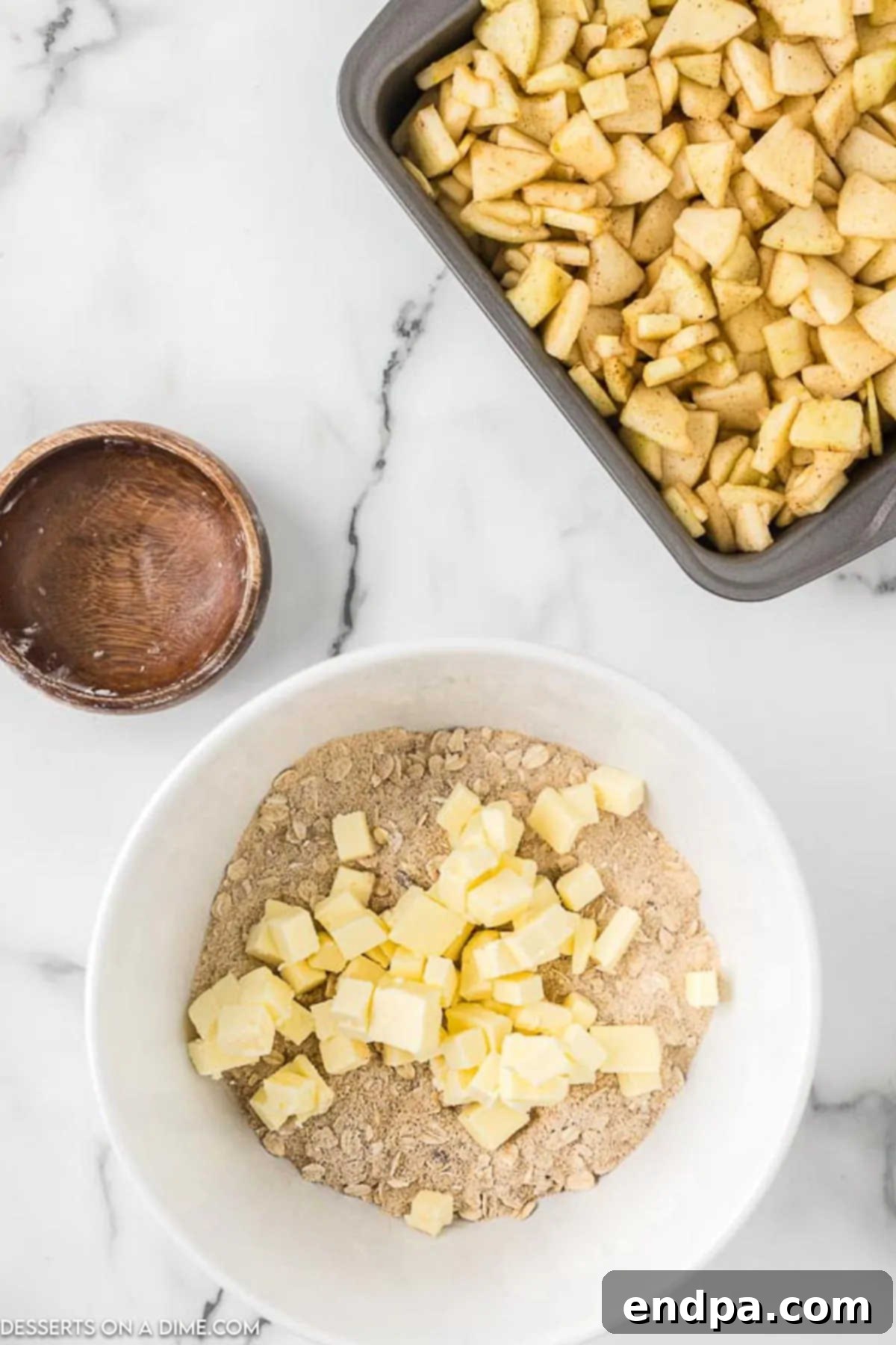 Buttery Oat Apple Crisp 7 Cold butter cut into the dry topping mixture.