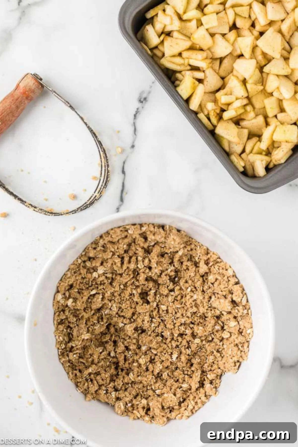Buttery Oat Apple Crisp 8 Butter fully cut into the topping mixture, creating a crumbly texture.