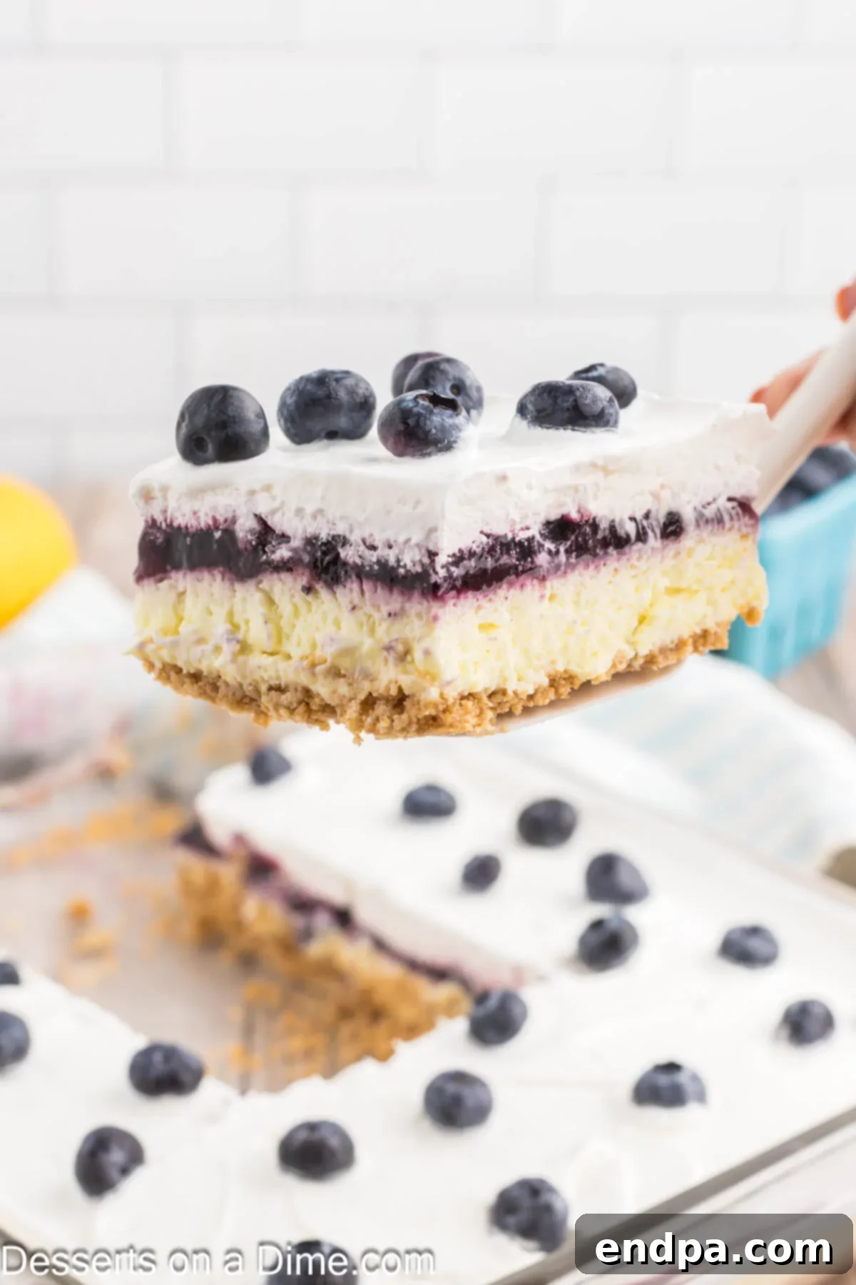 Lemon Blueberry Dessert being served.