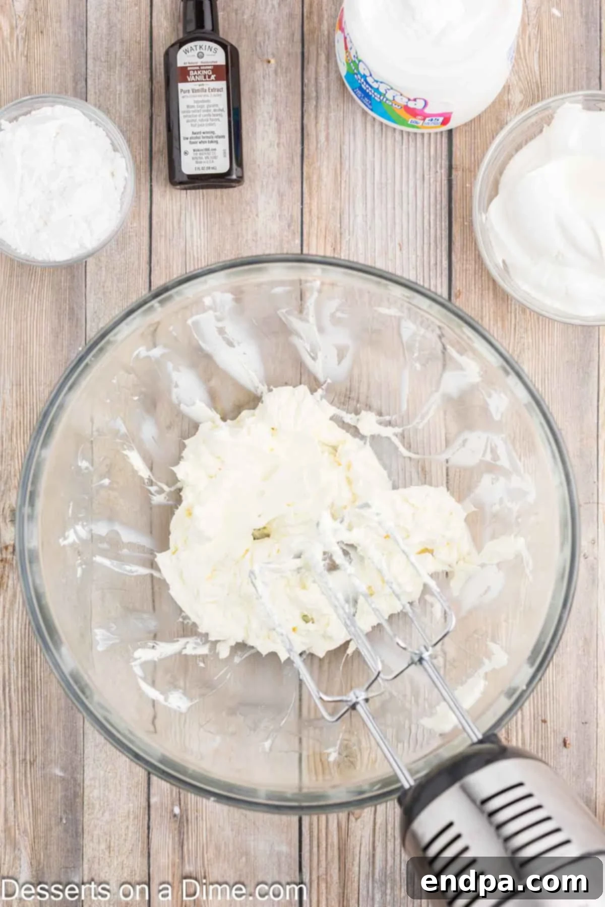 Luscious Cherry Cheesecake Dip 4 Electric mixer beating softened cream cheese in a large mixing bowl until smooth.