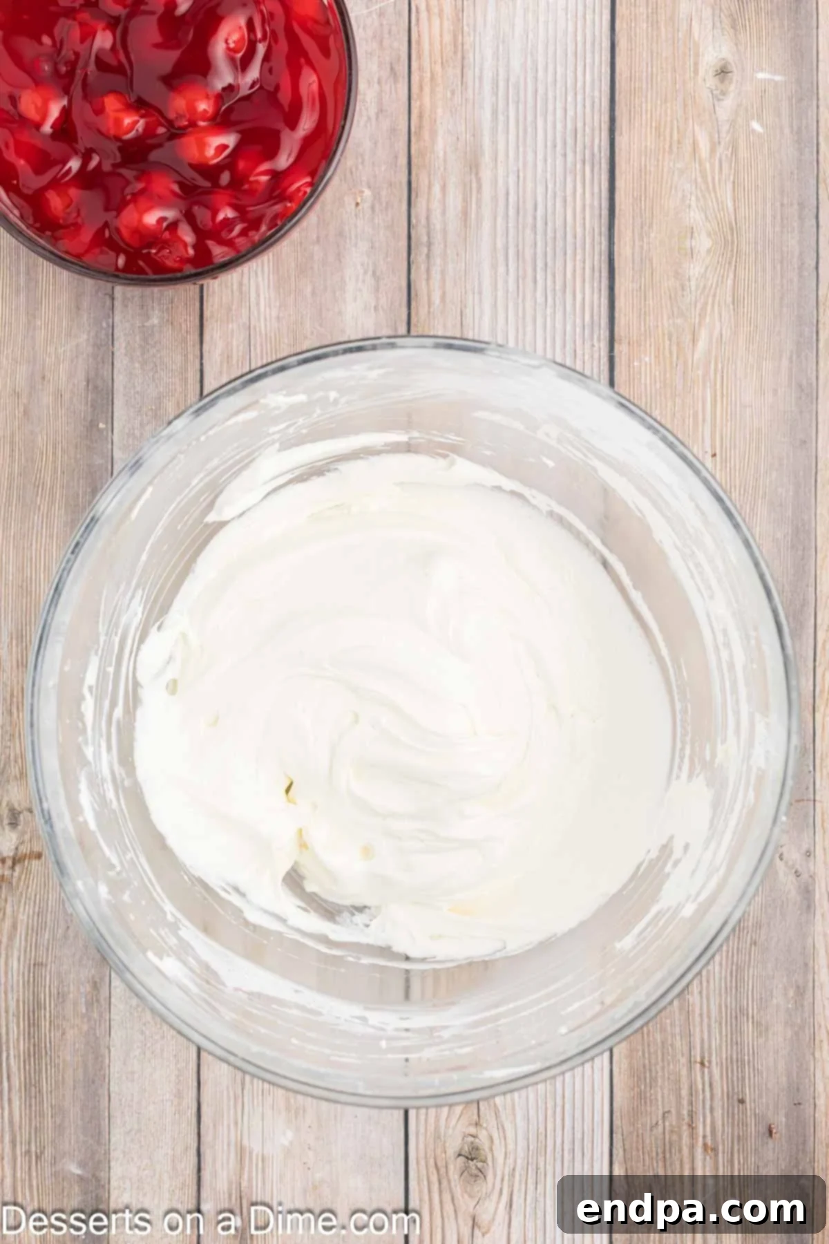 Luscious Cherry Cheesecake Dip 6 Whipped topping being gently folded into the cream cheese and marshmallow creme mixture.