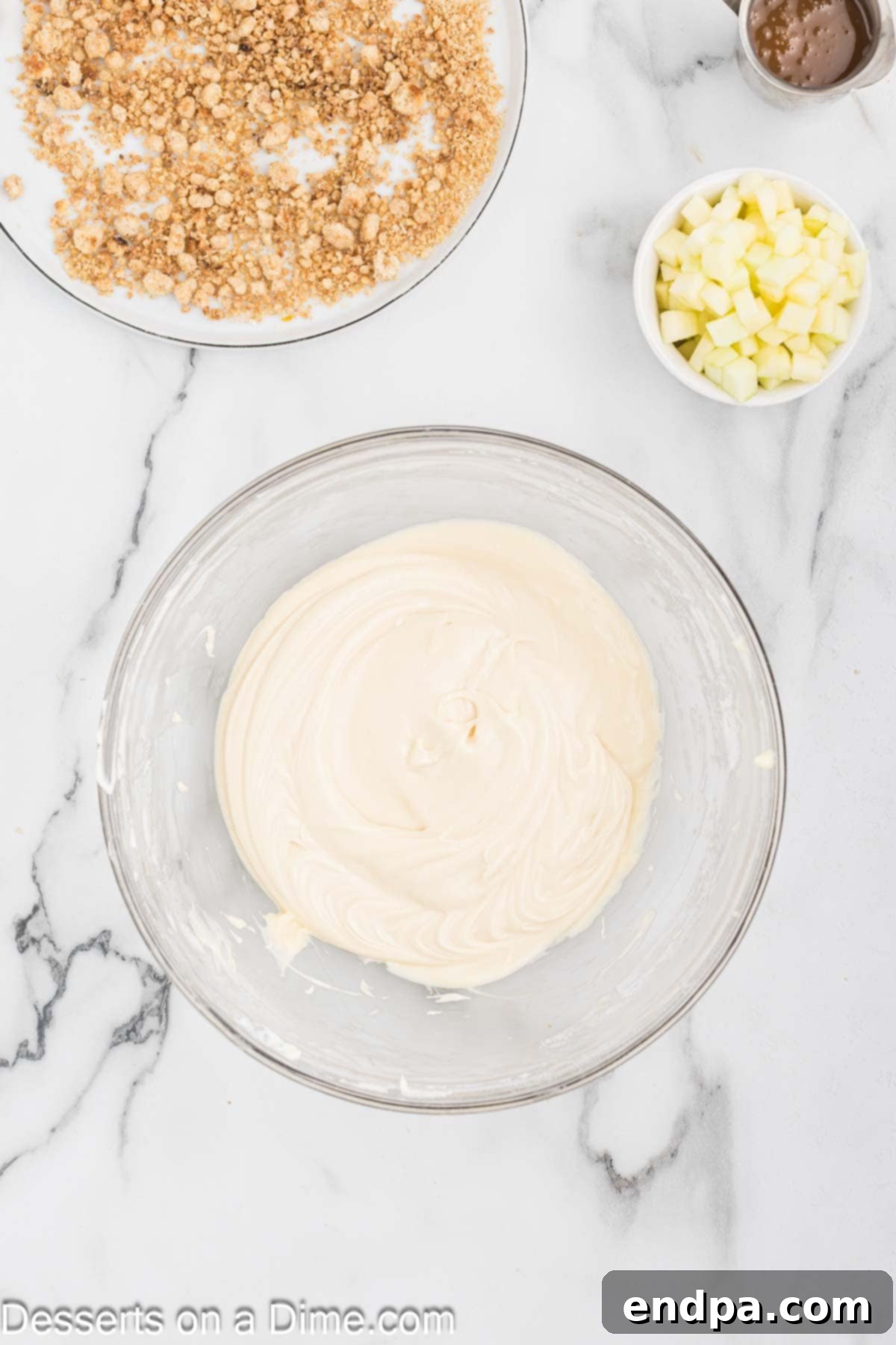 Caramel sauce, vanilla, and powdered sugar mixed into the cream cheese and butter frosting base.