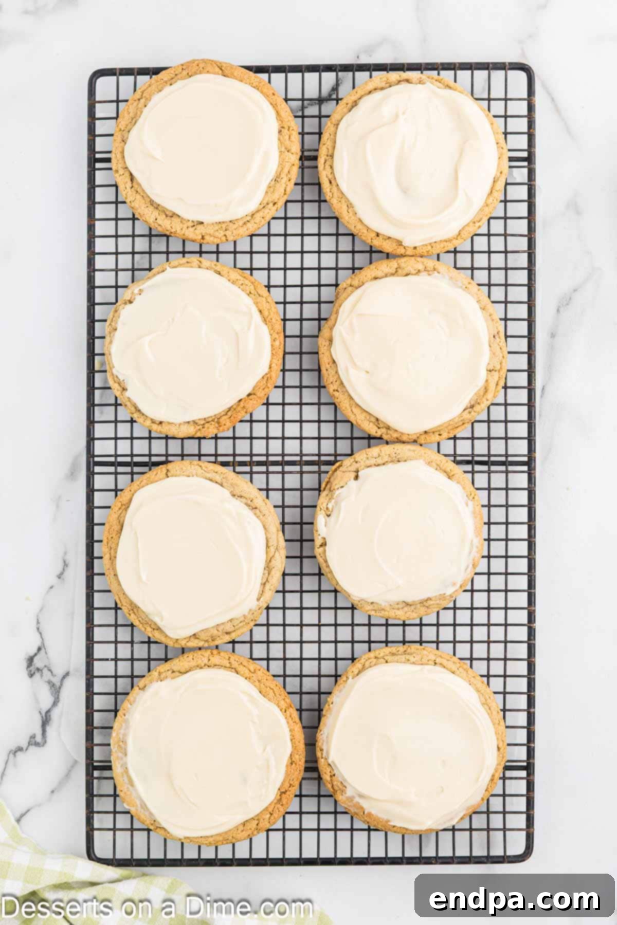 Cooled cookies topped with a generous layer of cream cheese caramel frosting.