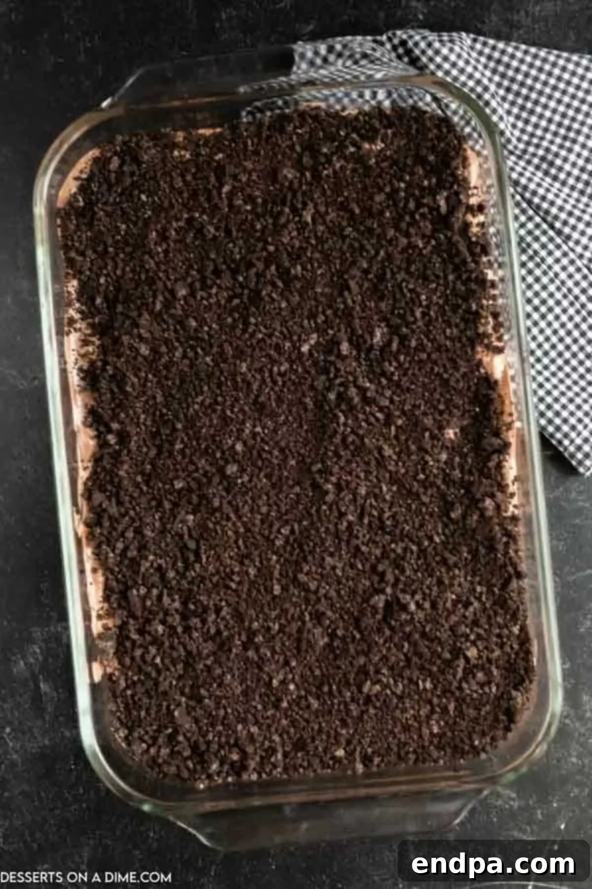 Remaining crushed Oreos sprinkled generously over the pudding layer.