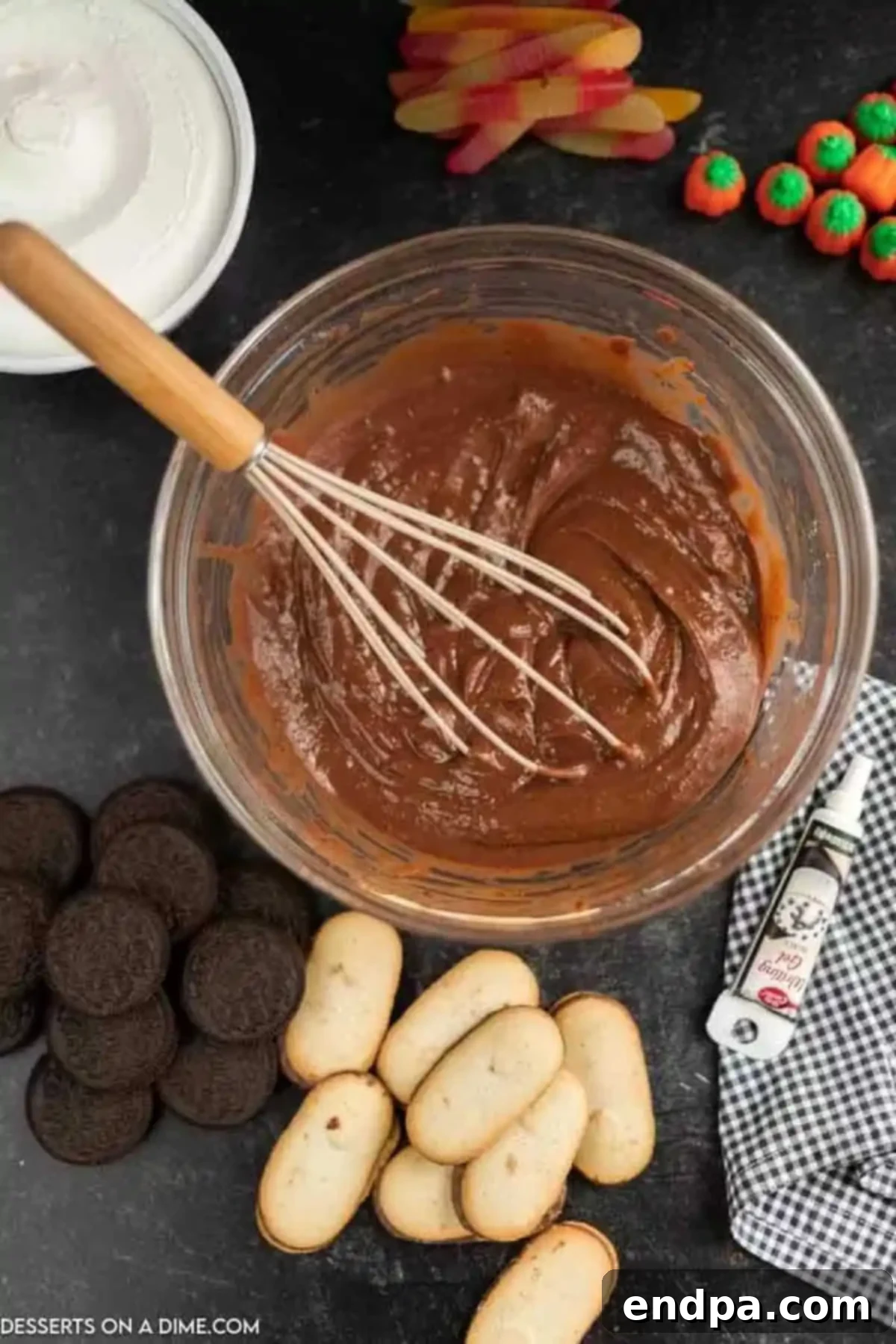 Instant chocolate pudding mix being whisked with cold milk in a mixing bowl.