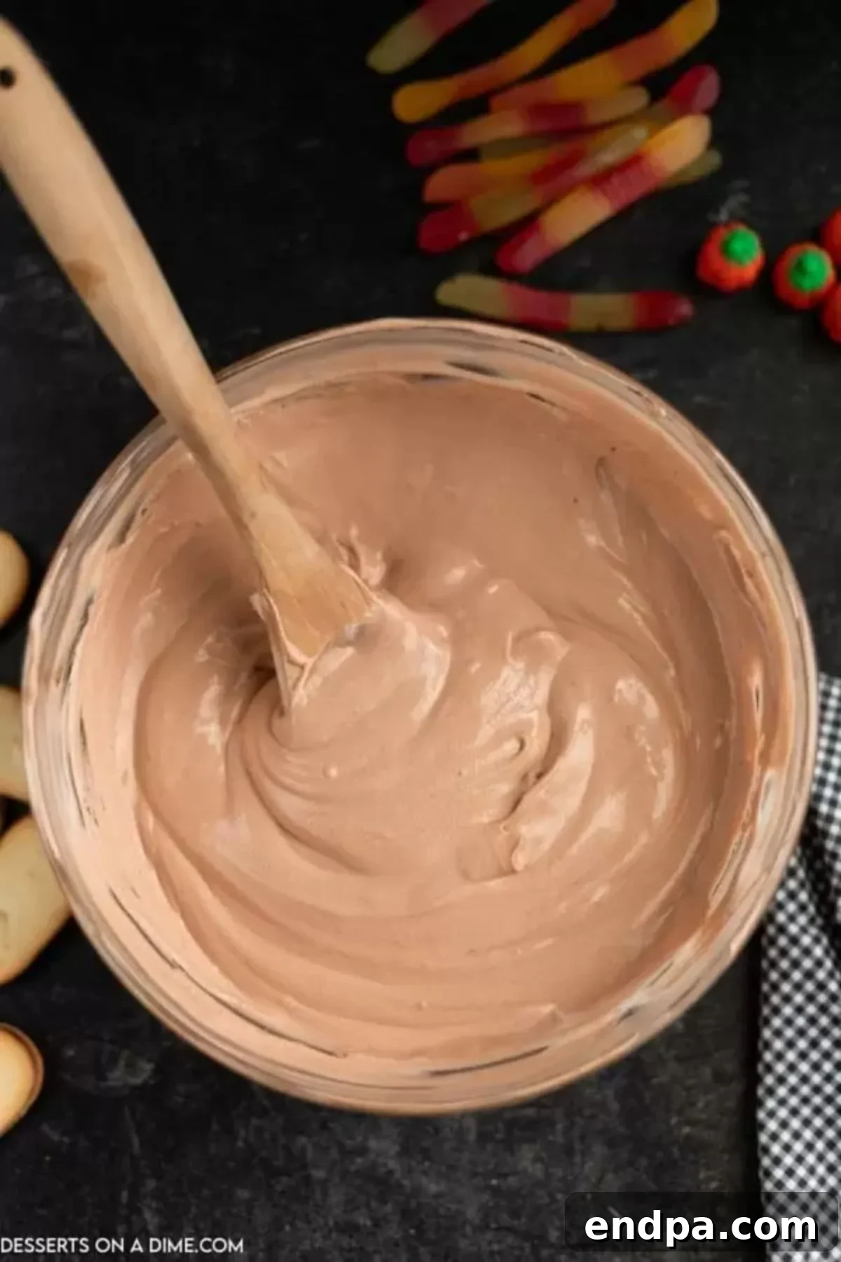 Set chocolate pudding mixed with creamy cool whip in a bowl.