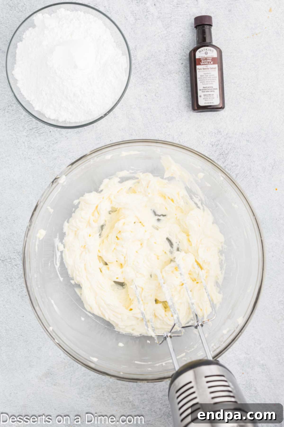 Autumn Pumpkin Cream Pies 9 A mixing bowl filled with beautifully smooth, creamy cream cheese frosting, showing its ideal texture and readiness for piping into whoopie pies.