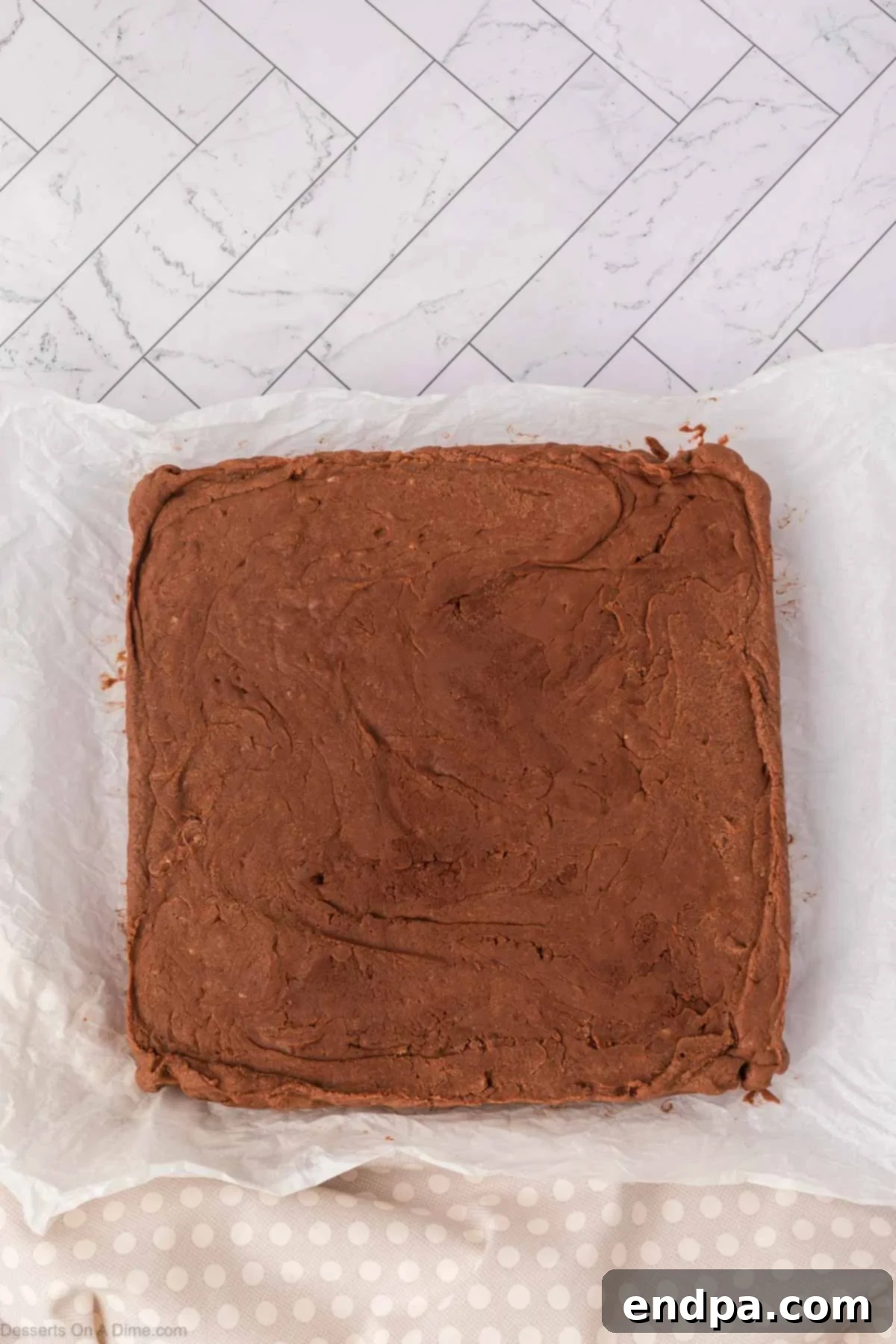 Marshmallow Fluff Fudge cut into perfect squares on a cutting board, ready for serving.