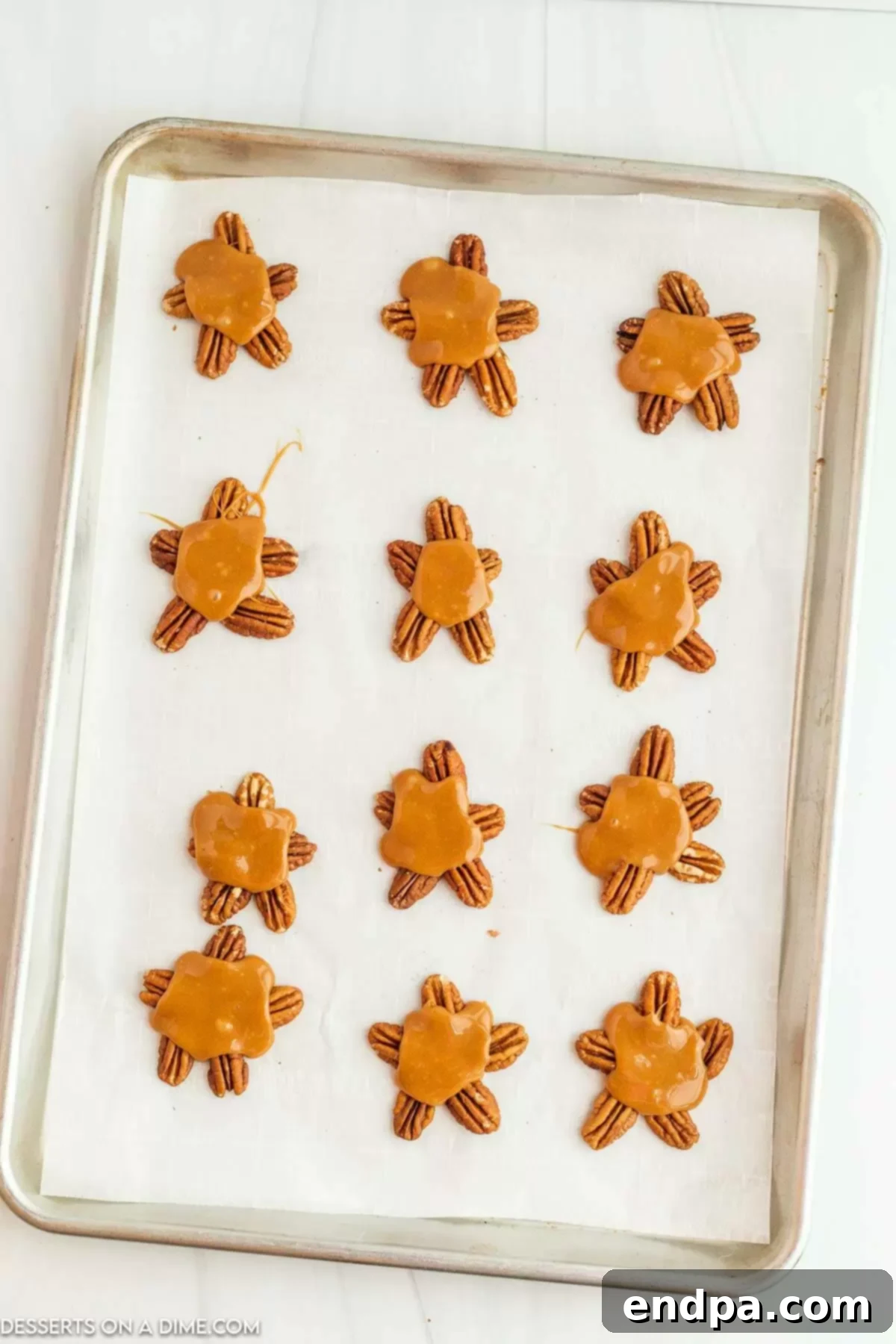 Melted caramel on top of pecans.