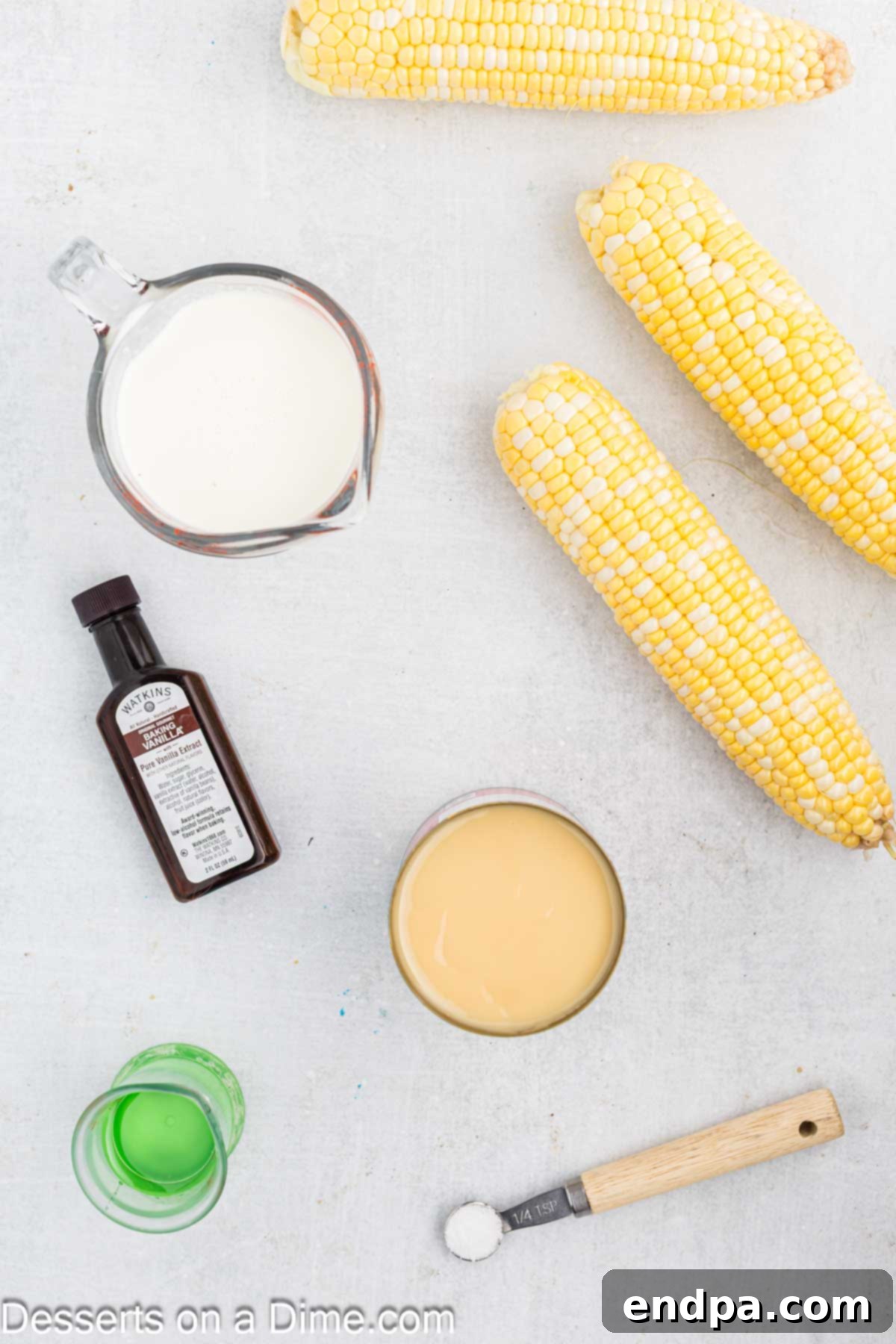 Ingredients for corn ice cream including fresh corn, heavy cream, sweetened condensed milk, corn syrup, vanilla extract, and salt.
