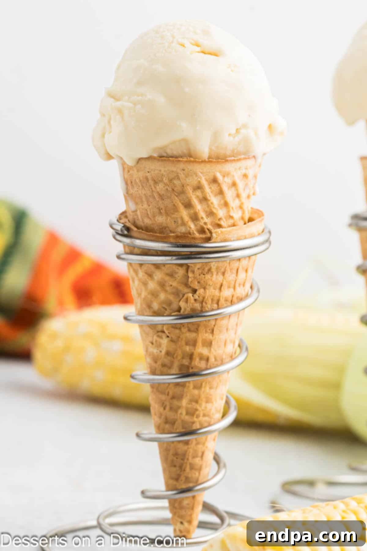 Scooped corn ice cream served in a waffle cone.