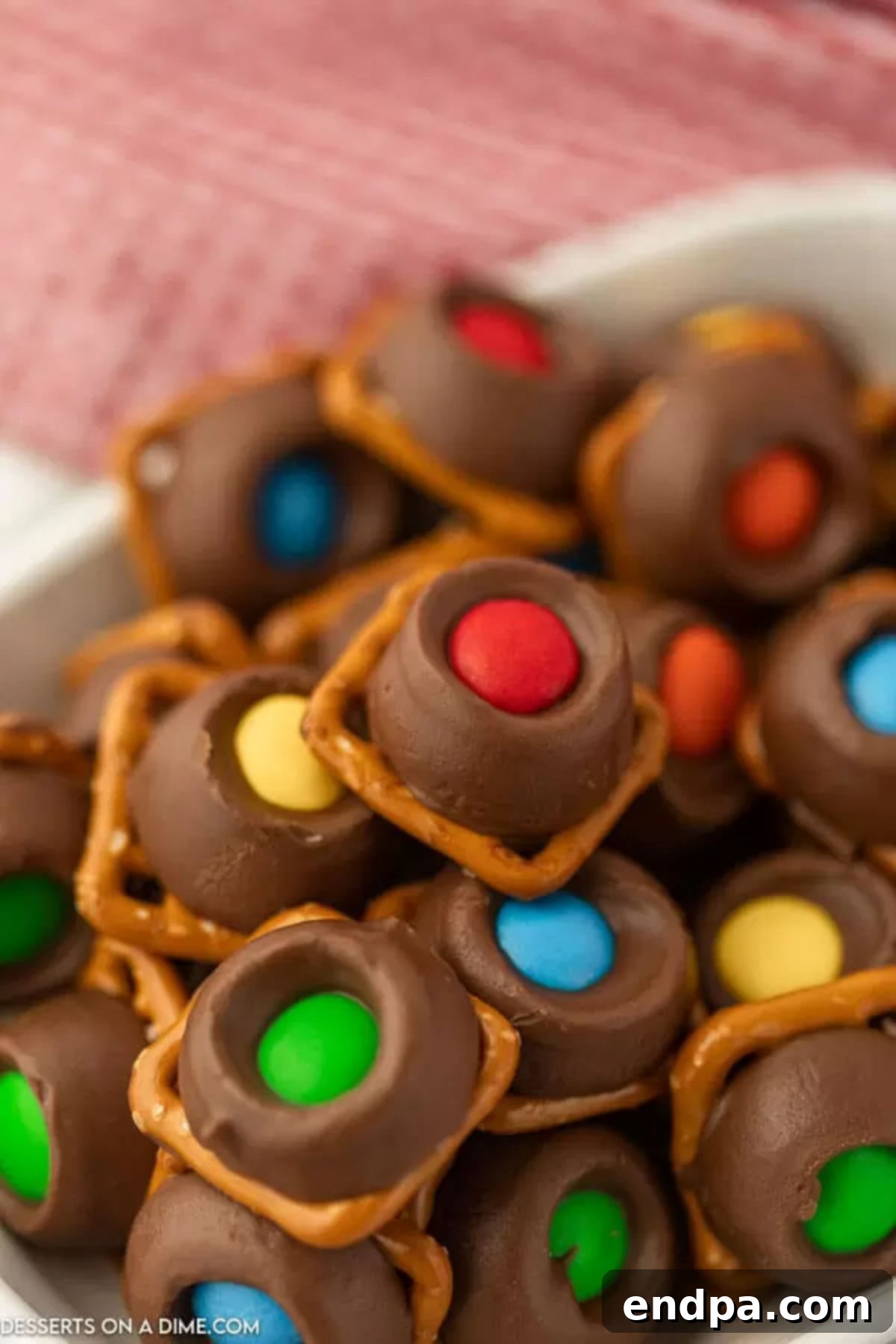 Close-up of a bowl filled with perfectly set Rolo Pretzel Bites, ready for serving.