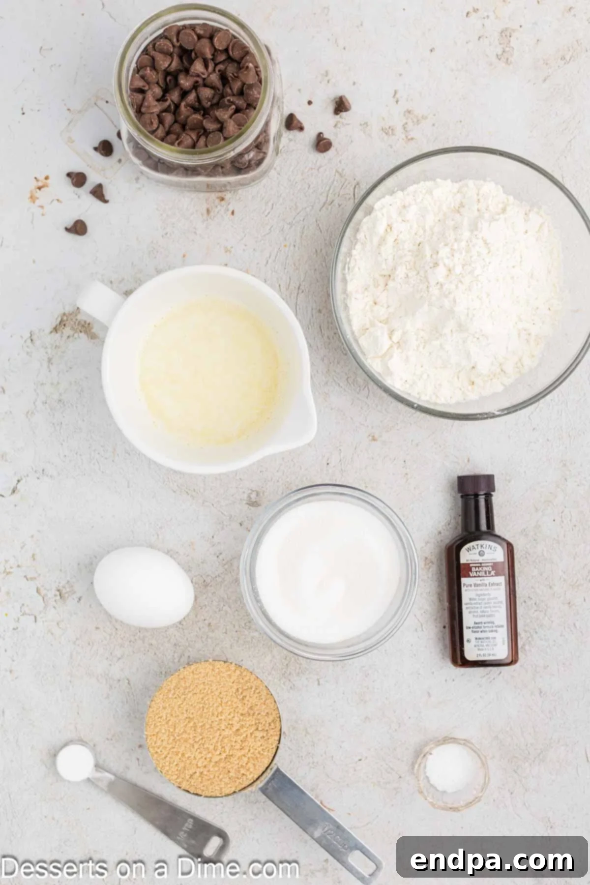 Warm & Gooey Air Fryer Pizookie 3 Ingredients for air fryer pizookie including unsalted butter, granulated sugar, brown sugar, vanilla extract, a large egg, all-purpose flour, baking soda, salt, and milk chocolate chips.