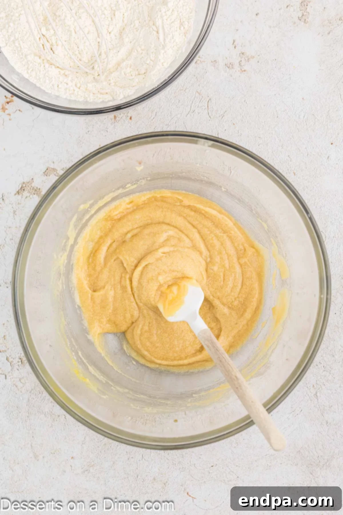 Warm & Gooey Air Fryer Pizookie 5 Melted butter combined with granulated and brown sugar in a mixing bowl.