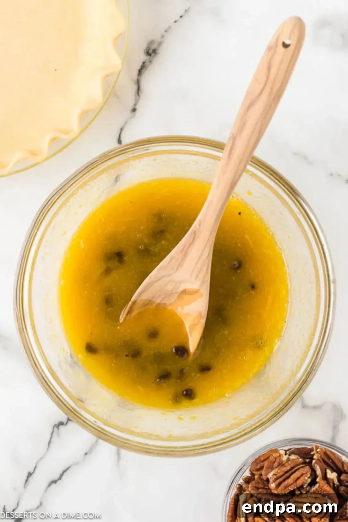 Gooey Chocolate Pecan Perfection 3 Mixing bowl with eggs and sugar mixture, starting the pie filling.