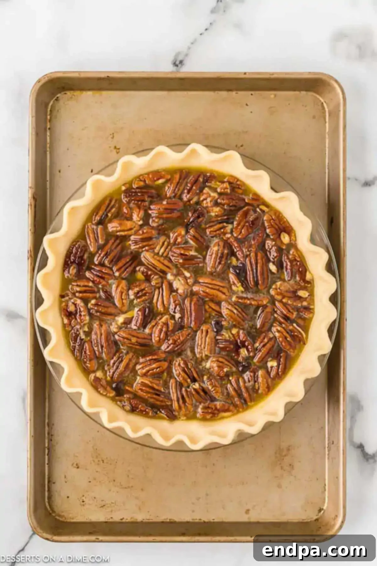 Gooey Chocolate Pecan Perfection 6 Pie plate on baking sheet to prevent spills while baking.