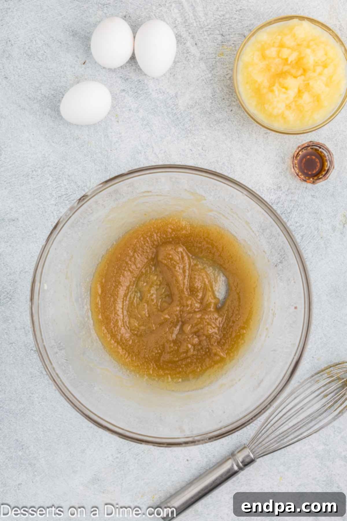 Tropical Banana Pineapple Loaf 4 Melted butter combined with brown sugar, forming a smooth mixture.