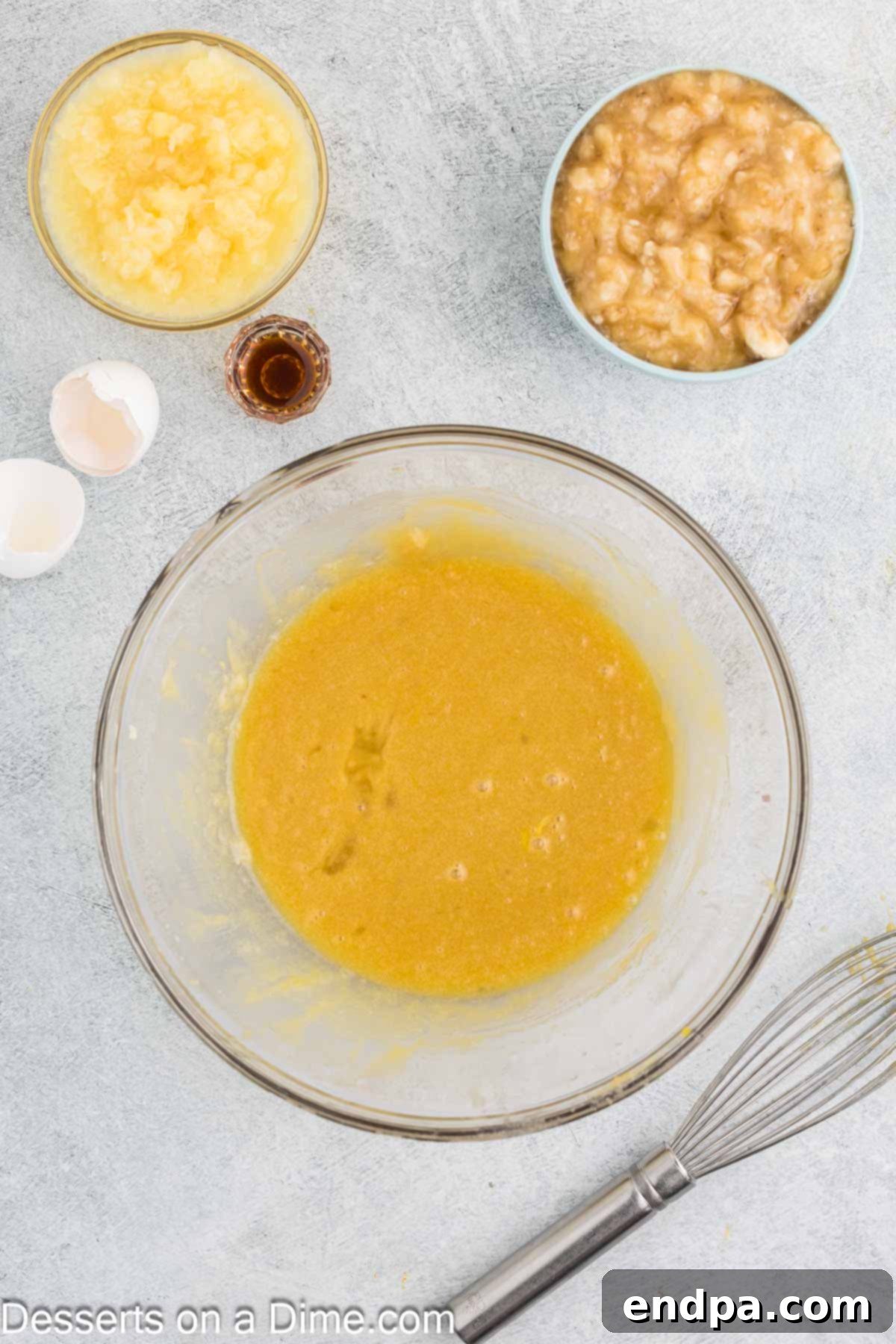 Tropical Banana Pineapple Loaf 5 Eggs whisked into the butter and sugar mixture until fully incorporated.