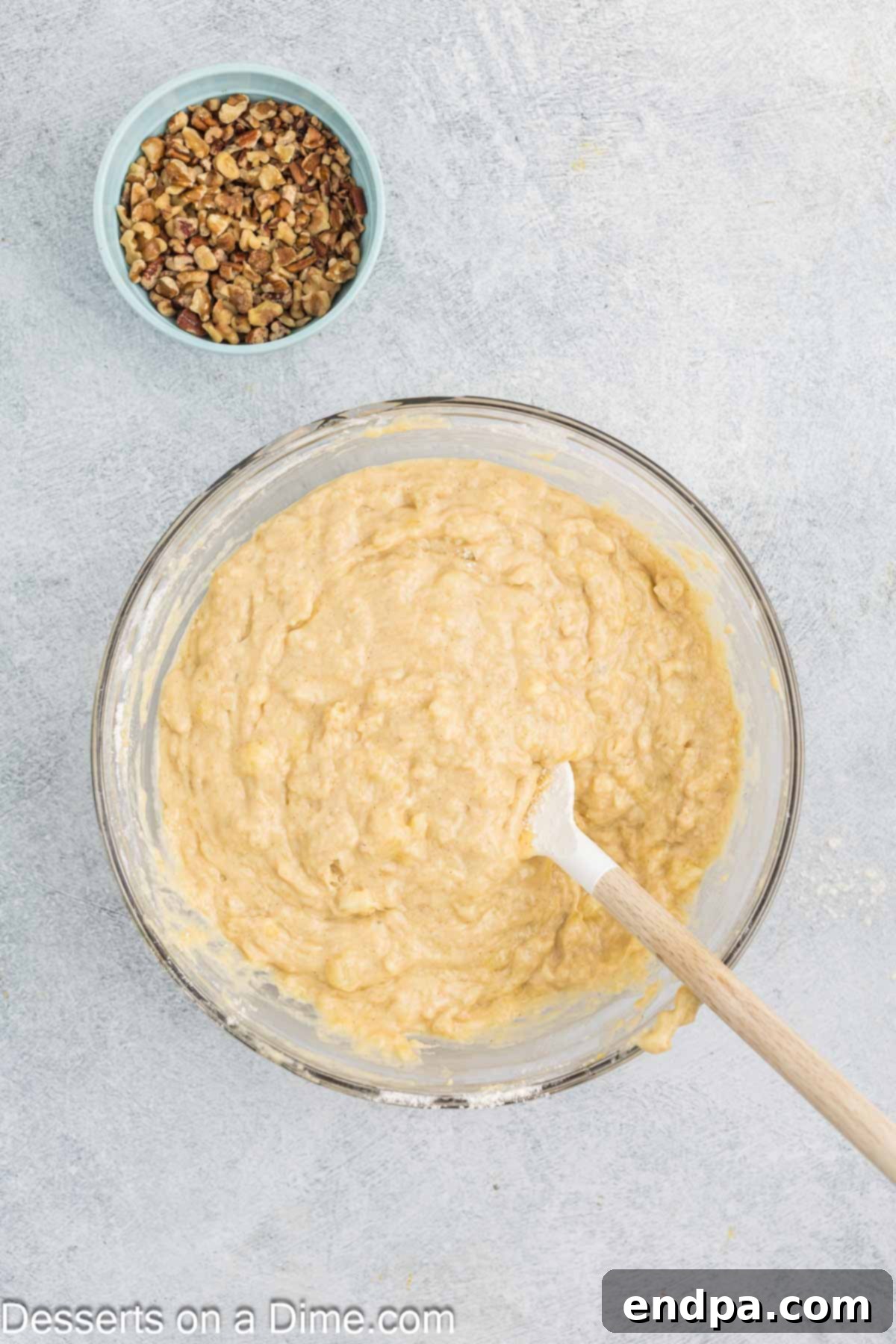 Tropical Banana Pineapple Loaf 7 Mashed bananas being stirred into the wet batter.