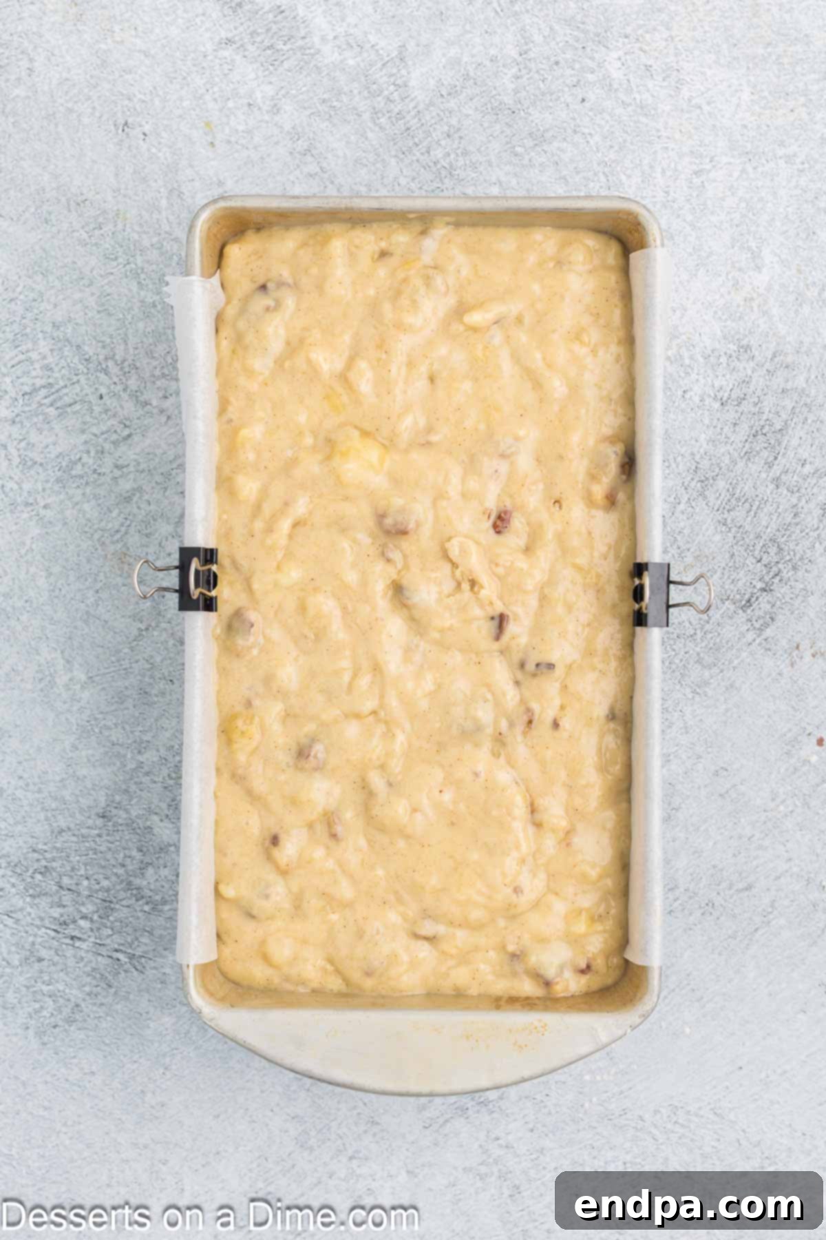 Tropical Banana Pineapple Loaf 9 Banana Pineapple bread batter spread evenly into a loaf pan.