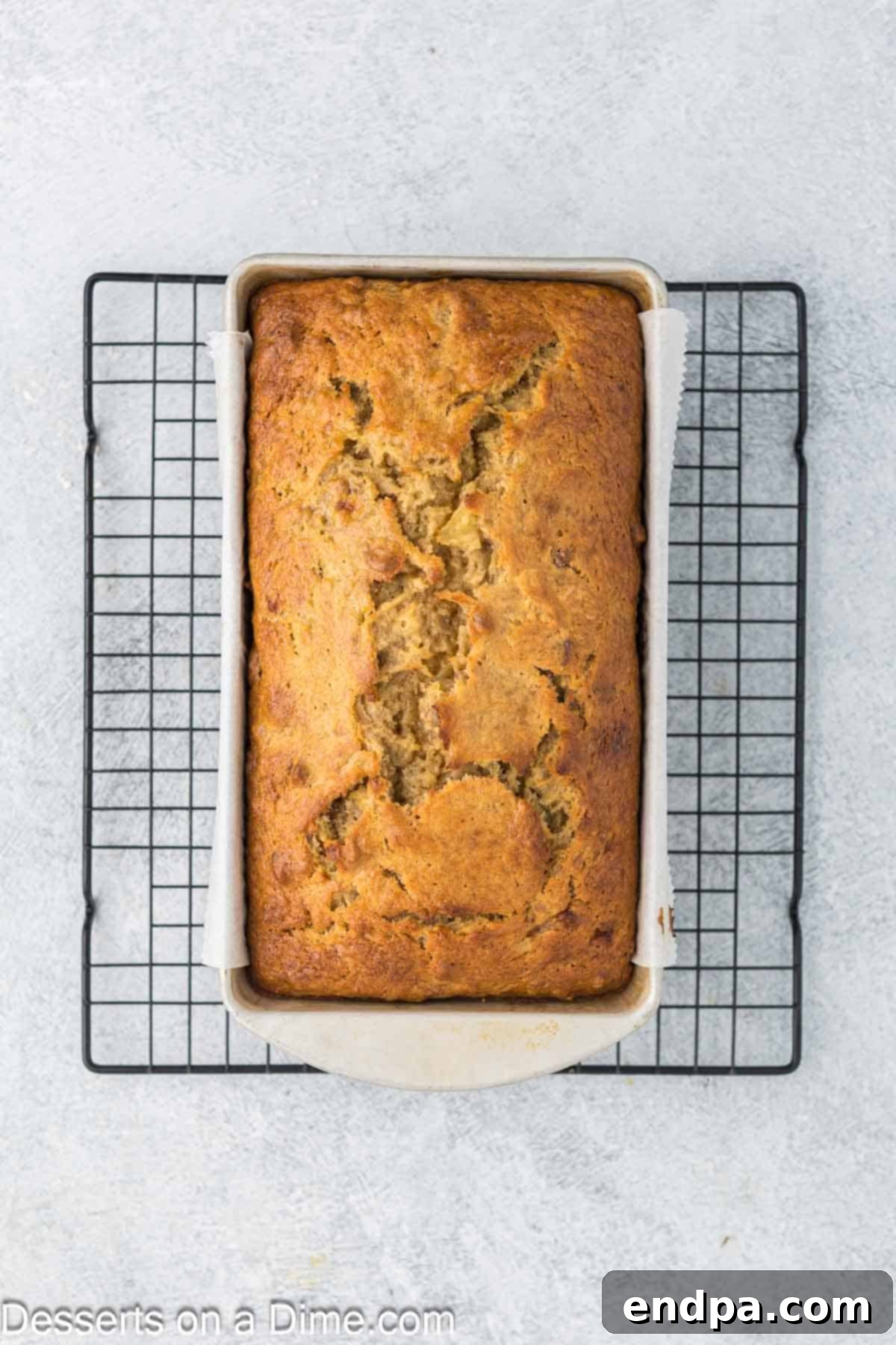 Tropical Banana Pineapple Loaf 10 Freshly baked Banana Pineapple bread cooling on a wire rack.