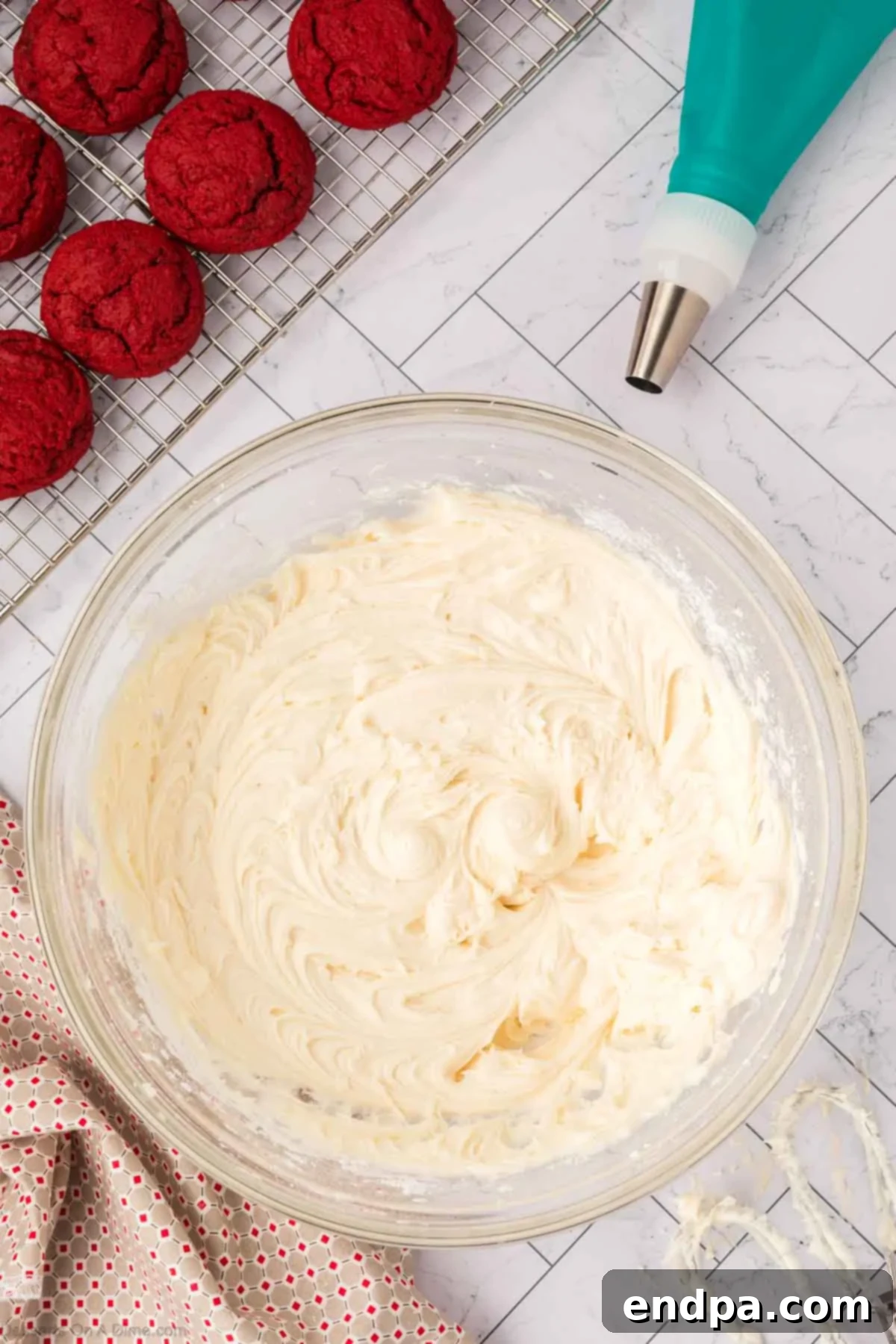 Cream cheese frosting ingredients combined and beaten until smooth in a mixing bowl.
