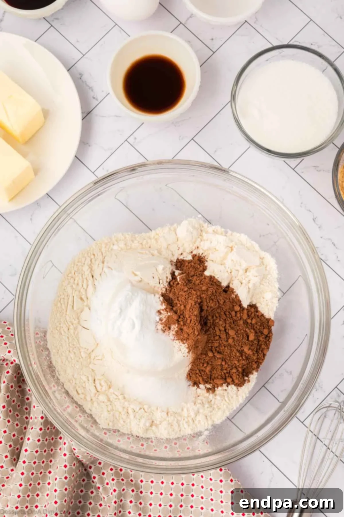 Mixing bowl with dry ingredients for red velvet cookies.