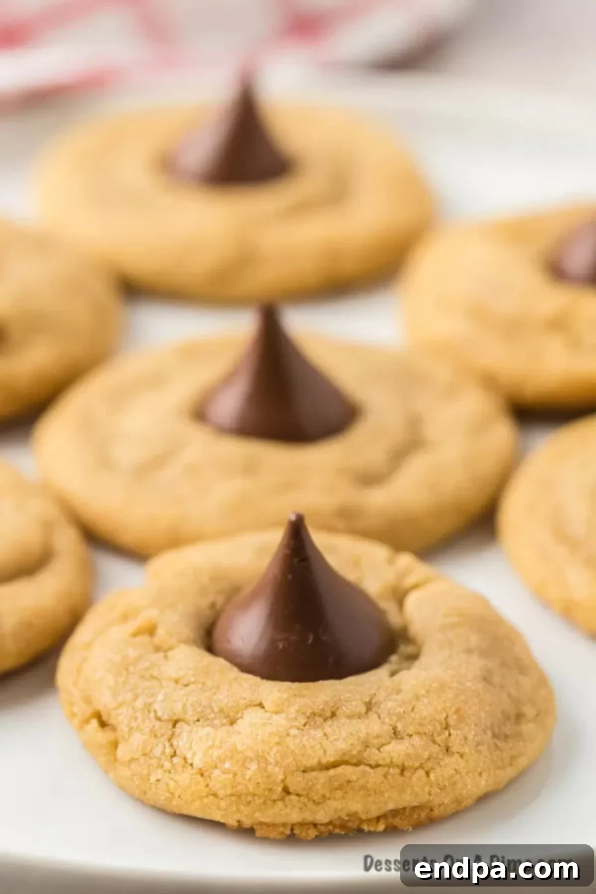 A platter of beautifully baked Peanut Butter Hershey Kiss Cookies, ready to be enjoyed.