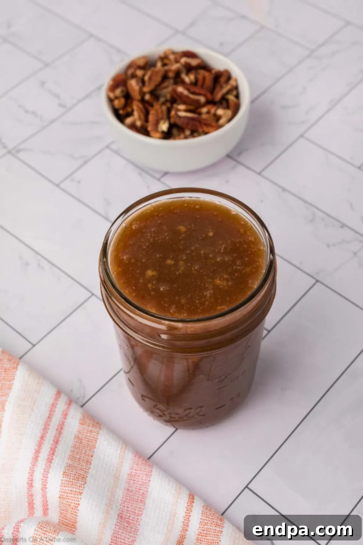 Velvet Sweet Potato Cheesecake 19 Homemade salted caramel topping in a glass jar.