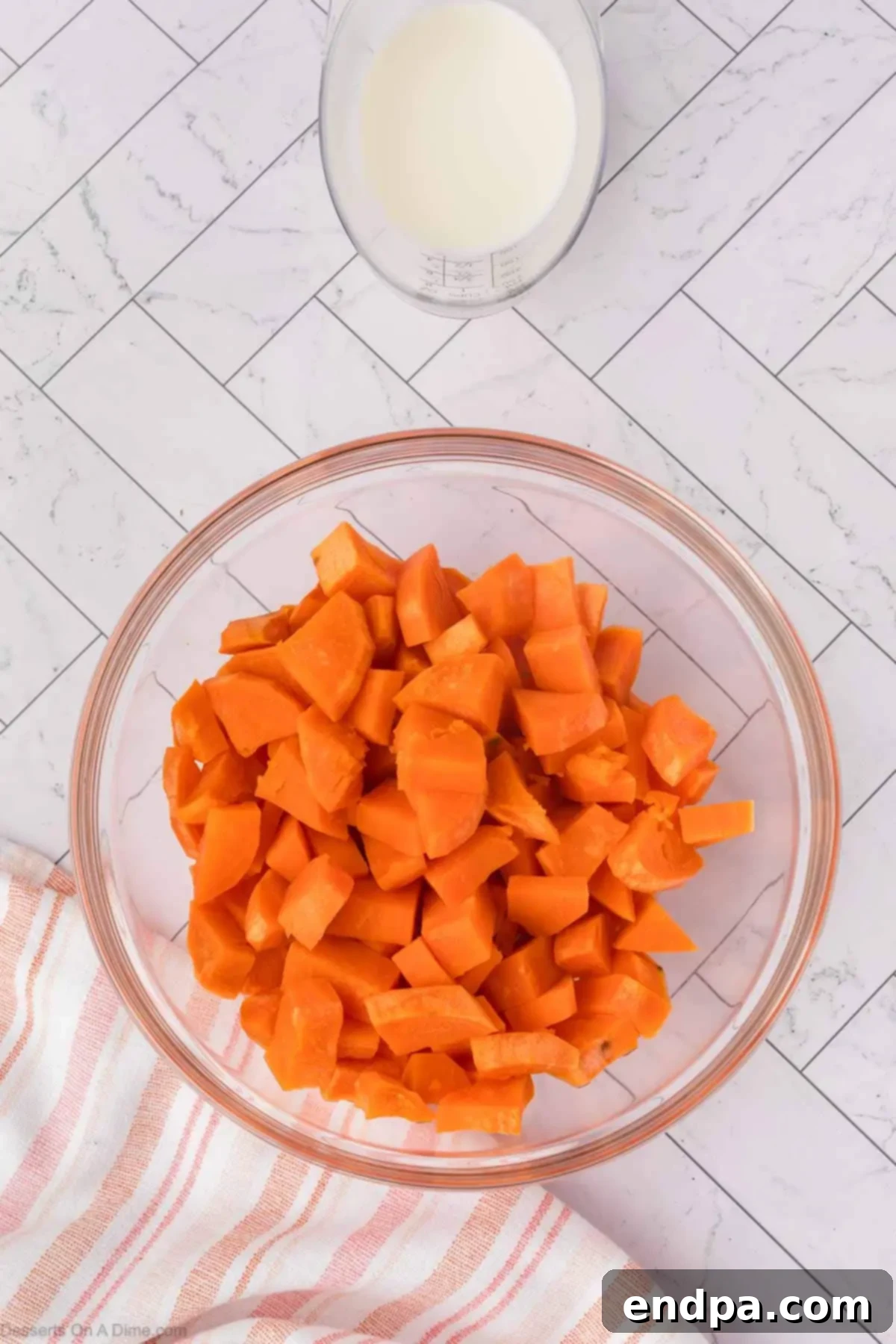 Velvet Sweet Potato Cheesecake 4 Diced sweet potatoes in a bowl, ready for microwaving.