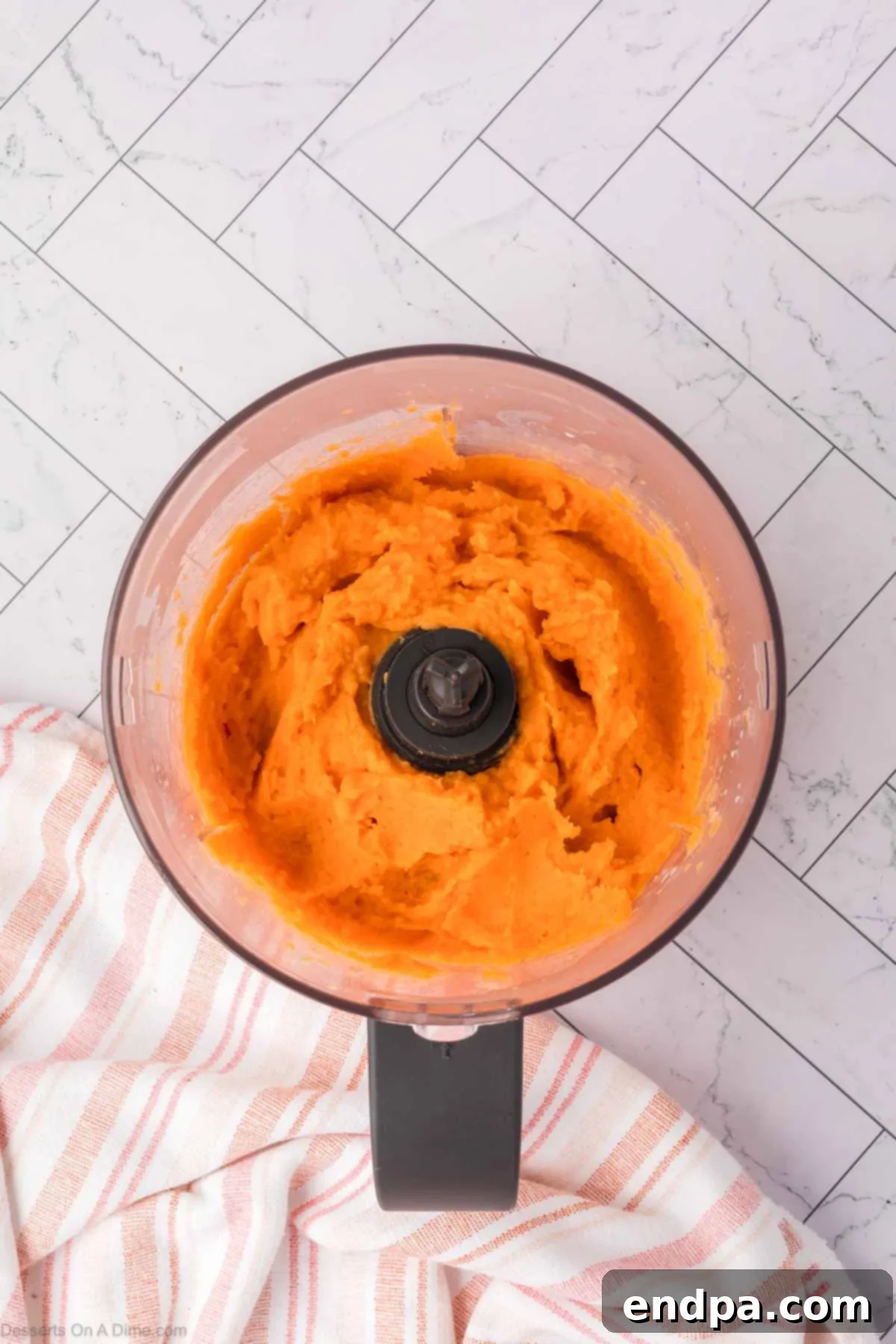 Velvet Sweet Potato Cheesecake 6 Smooth sweet potato puree in a food processor bowl.