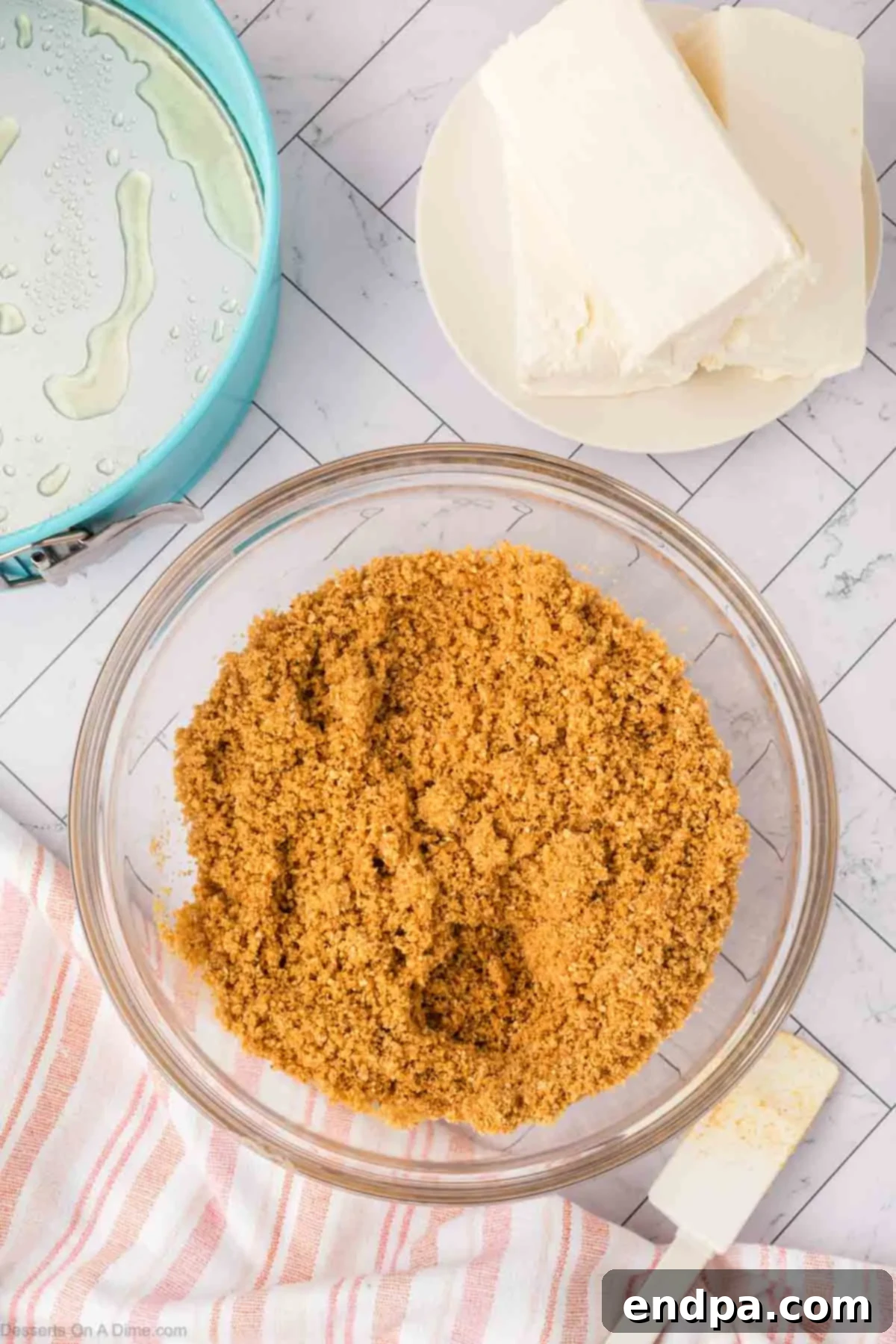 Velvet Sweet Potato Cheesecake 7 Graham cracker crumbs mixed with melted butter in a bowl.
